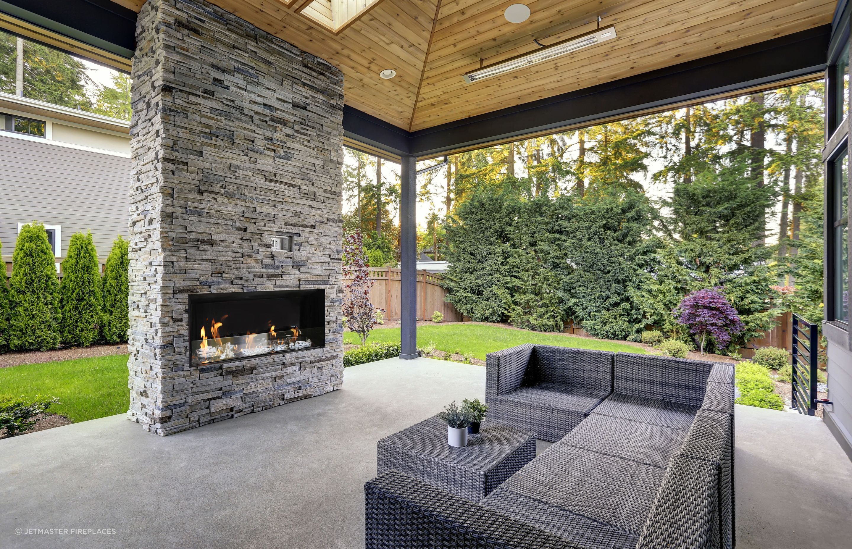 Complete an outdoor room with a fireplace that seamlessly fits with the existing design