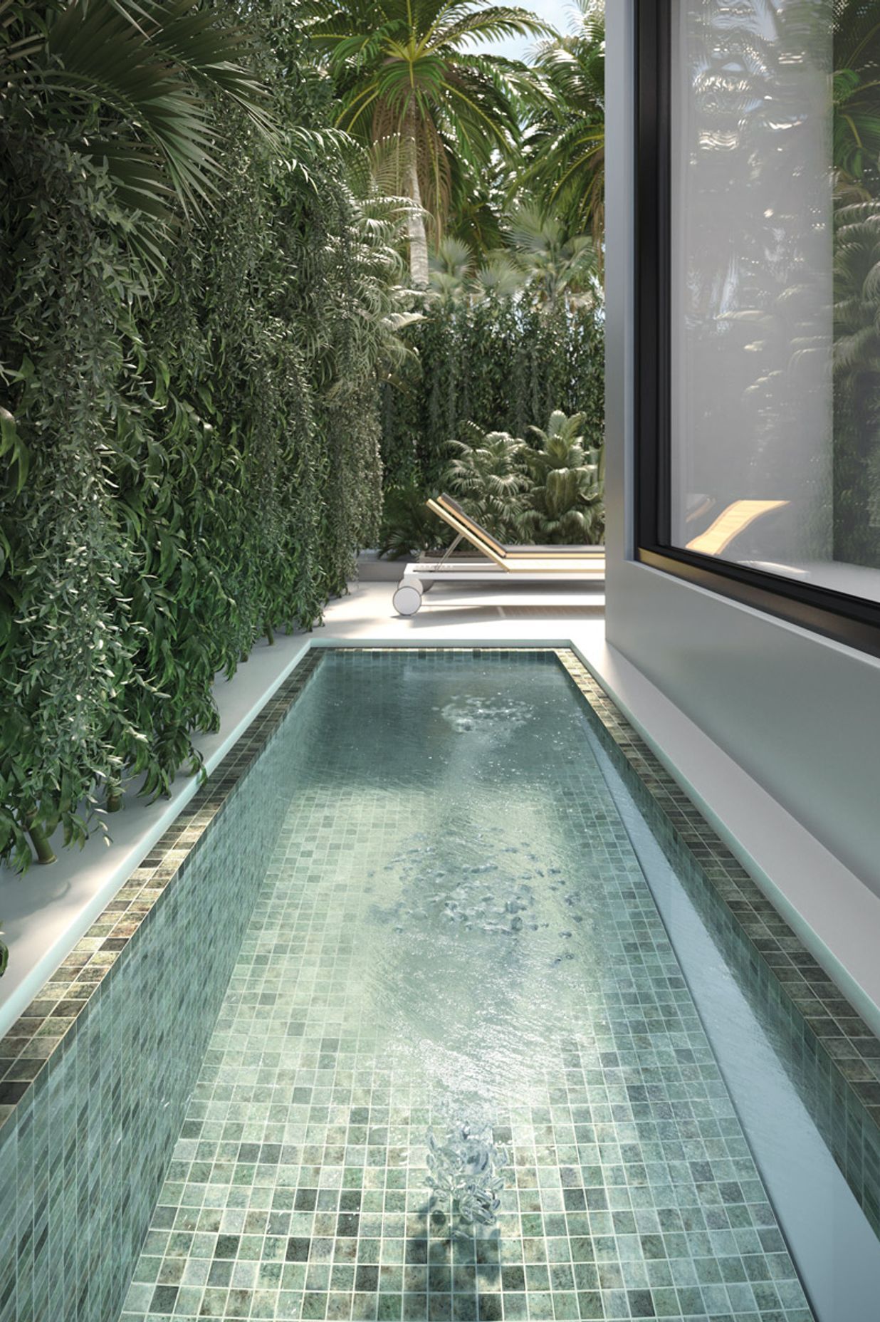 Tiles in shades of grey, brown and stone help create the visual effect of crystal-clear water in this swimming pool.
