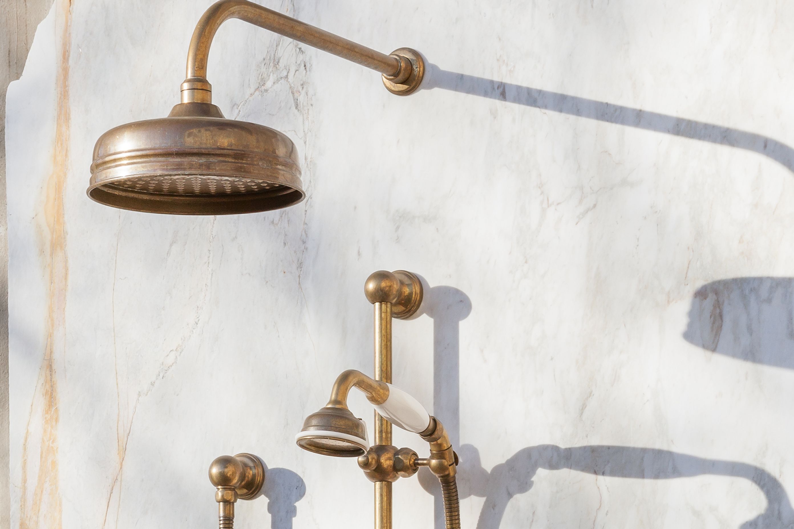 Some showers feature a fixed shower head and a hand shower.