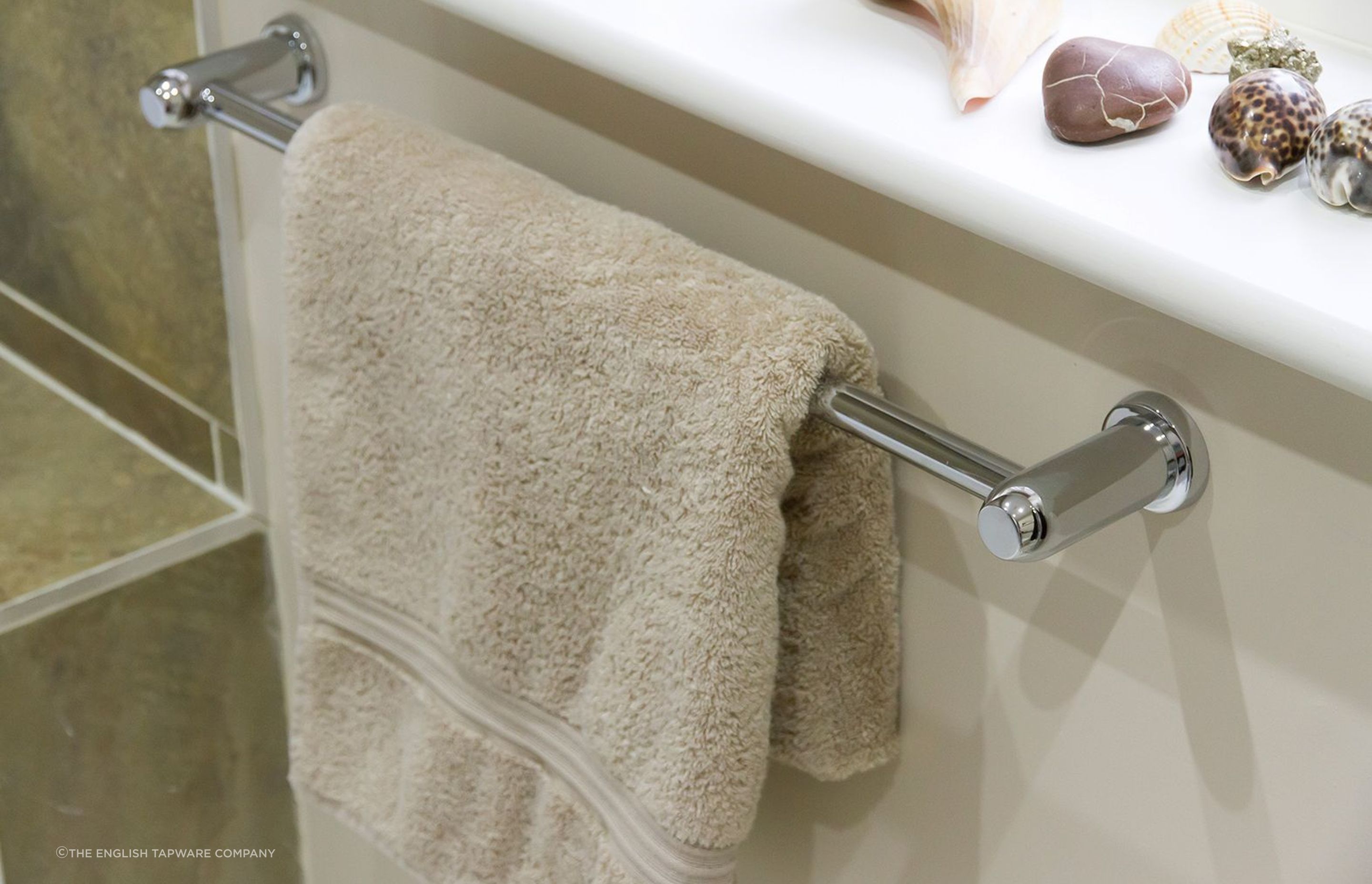 A traditional towel supported by a Perrin &amp; Rowe Contemporary Towel Rail from The English Tapware Company