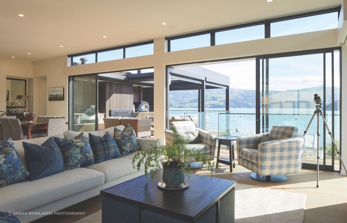 Interior reflections: "Every home is a special undertaking," says Lili from Lili's Interiors. "The interiors need to be a continuation of the outdoor landscape.” White walls were chosen with blues and greens for the soft furnishings, mimicking the muted colours of the sea and hills. Cushion and sofa fabrics are from Ralph Lauren, Anna French and Warwick. Elegant, yet comfortable, and designed to be enjoyed by the family.