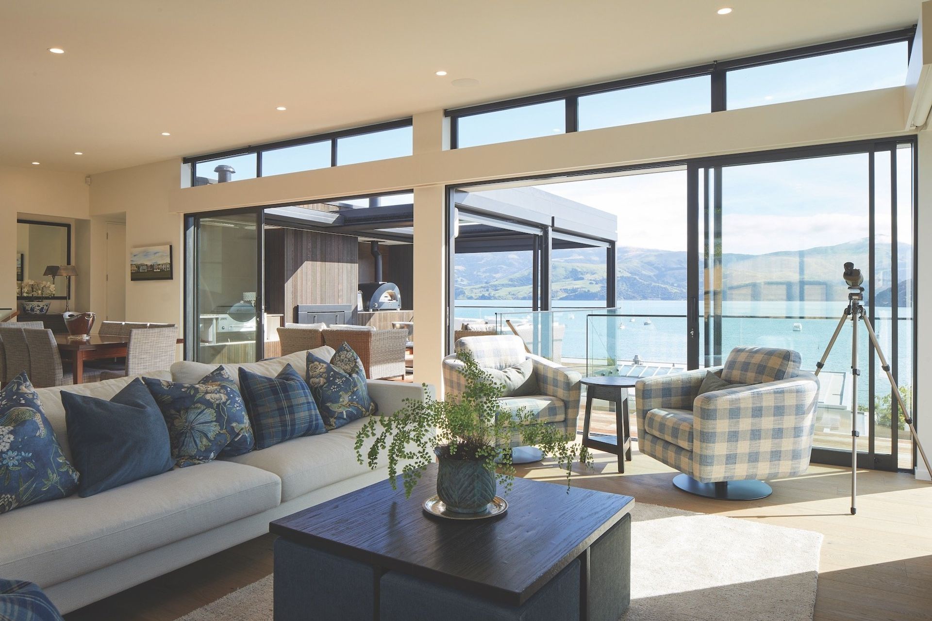 Interior reflections: "Every home is a special undertaking," says Lili from Lili's Interiors. "The interiors need to be a continuation of the outdoor landscape.” White walls were chosen with blues and greens for the soft furnishings, mimicking the muted colours of the sea and hills. Cushion and sofa fabrics are from Ralph Lauren, Anna French and Warwick. Elegant, yet comfortable, and designed to be enjoyed by the family.