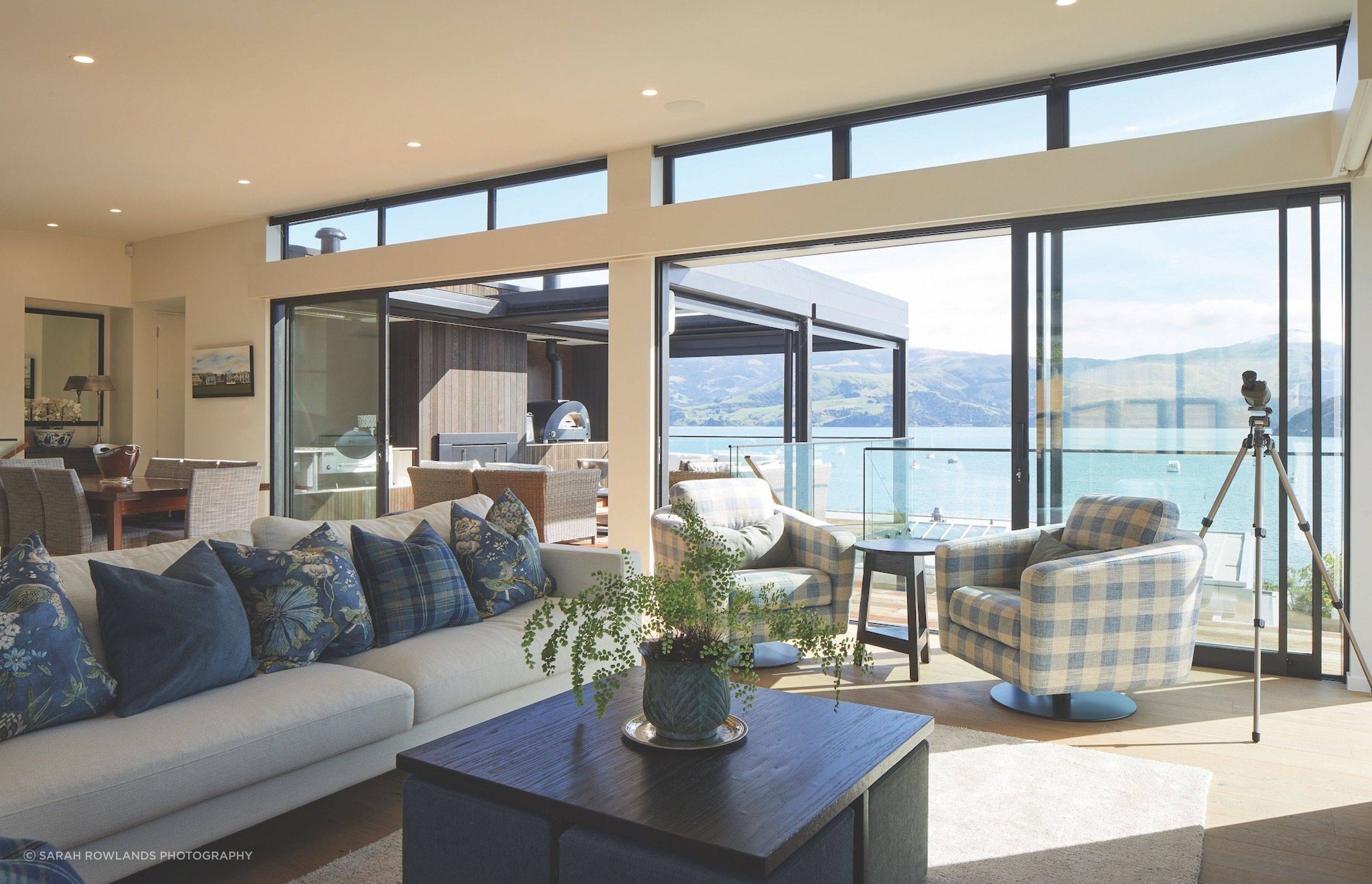 Interior reflections: "Every home is a special undertaking," says Lili from Lili's Interiors. "The interiors need to be a continuation of the outdoor landscape.” White walls were chosen with blues and greens for the soft furnishings, mimicking the muted colours of the sea and hills. Cushion and sofa fabrics are from Ralph Lauren, Anna French and Warwick. Elegant, yet comfortable, and designed to be enjoyed by the family.