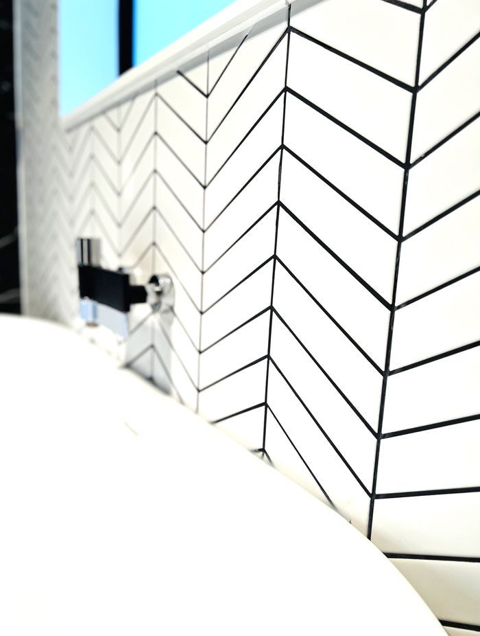 Clever use of tiles and grouting in both colour and direction.