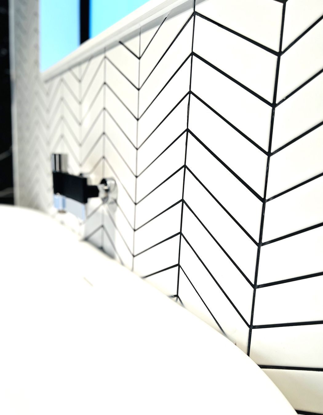 Clever use of tiles and grouting in both colour and direction.