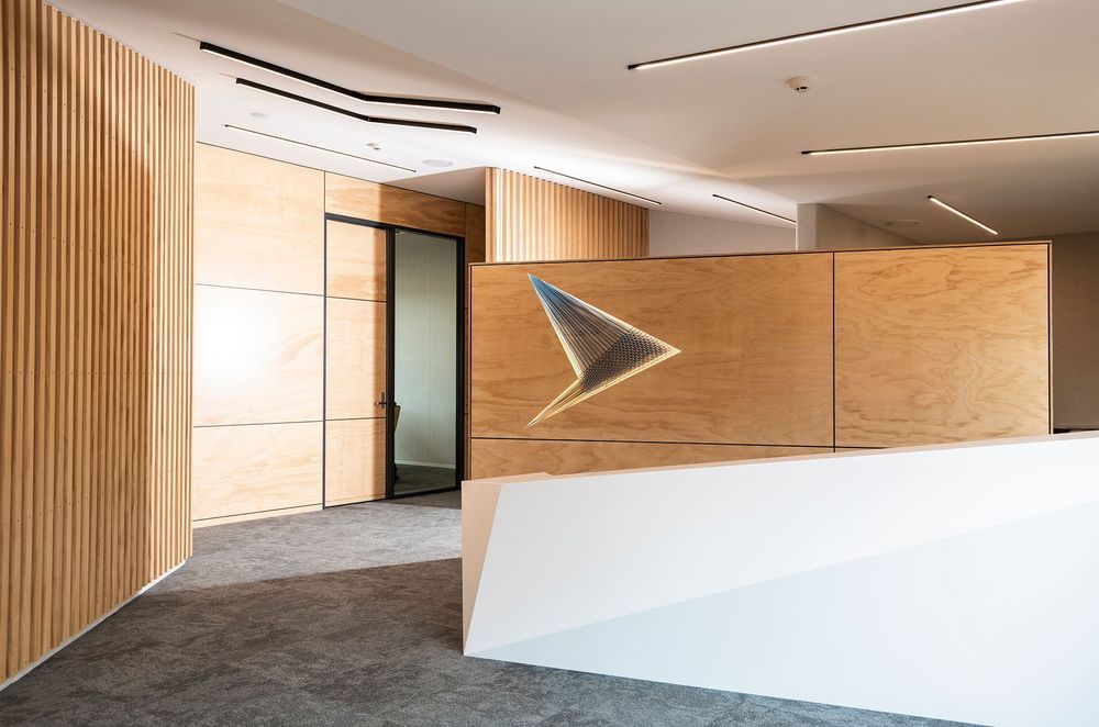 Tavolo Coronet was selected for its elegant and warm white colour profile and the surface left with a matte finish to perfectly complement the timber accents in this newly refurbished office space.