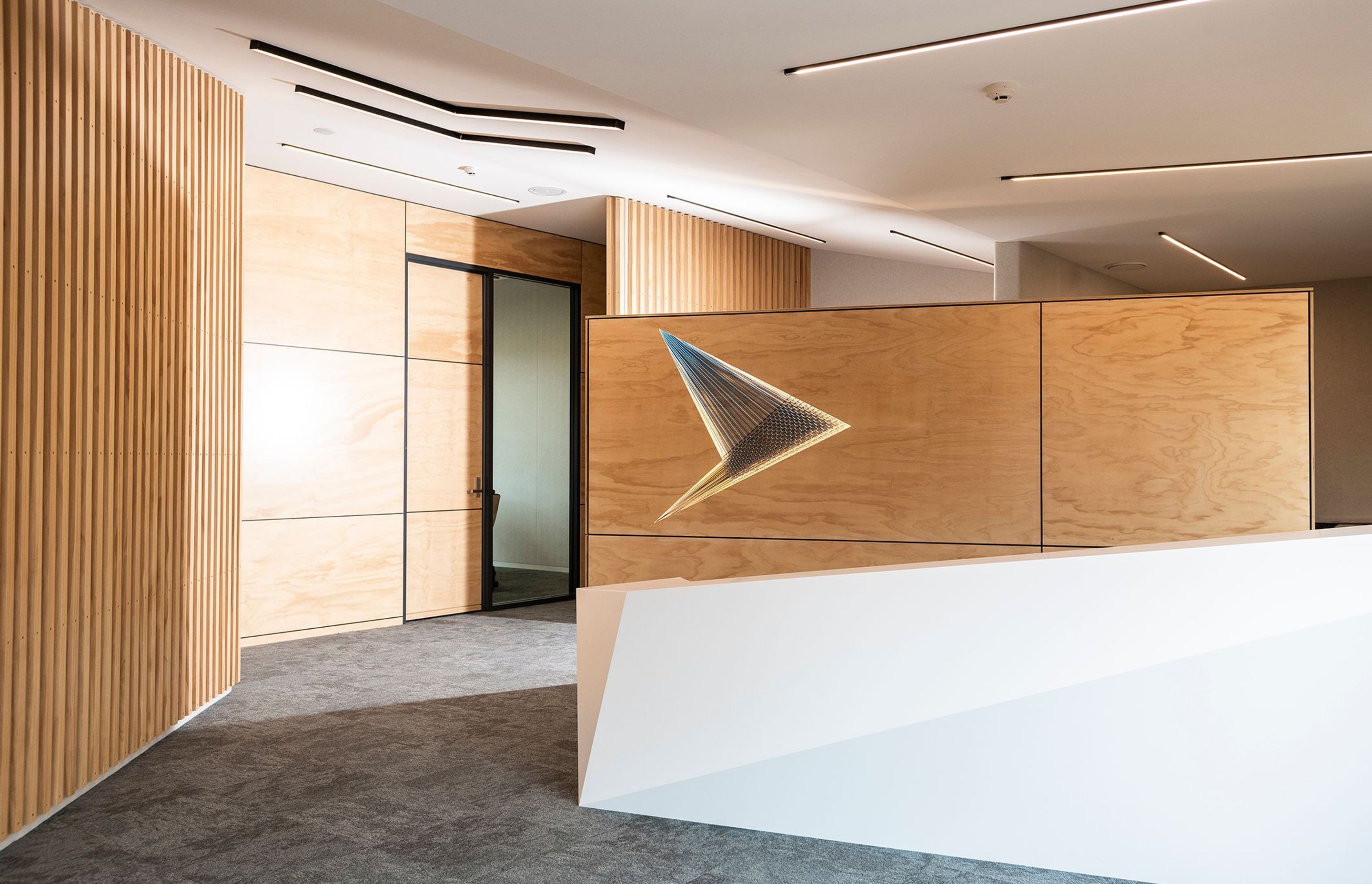 Tavolo Coronet was selected for its elegant and warm white colour profile and the surface left with a matte finish to perfectly complement the timber accents in this newly refurbished office space.