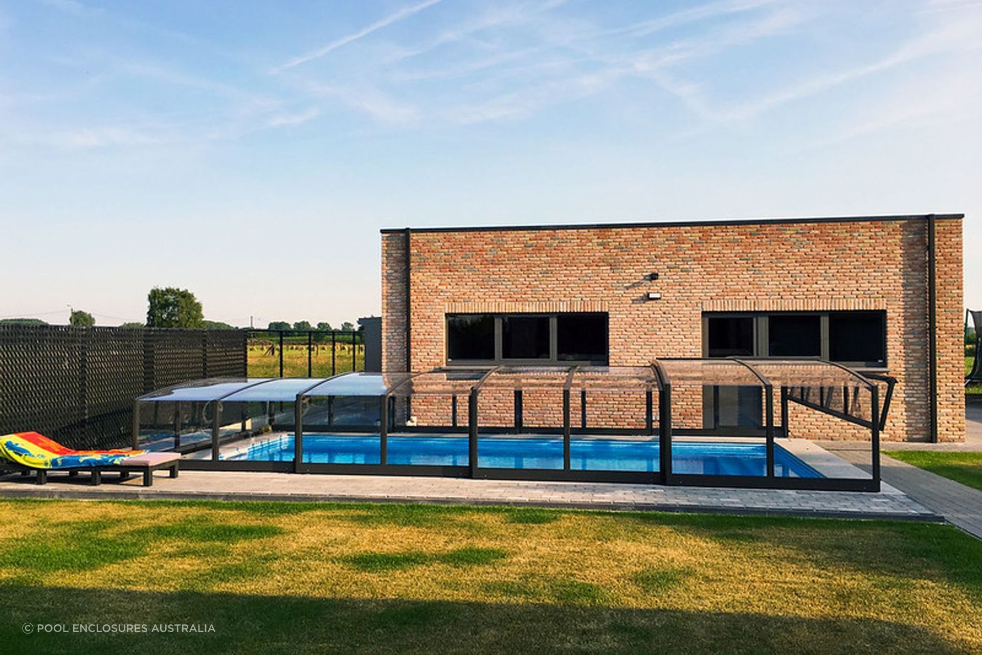 A pool enclosure is an innovative alternative to a traditional pool fence. Featured product: Viva Pool Enclosure.