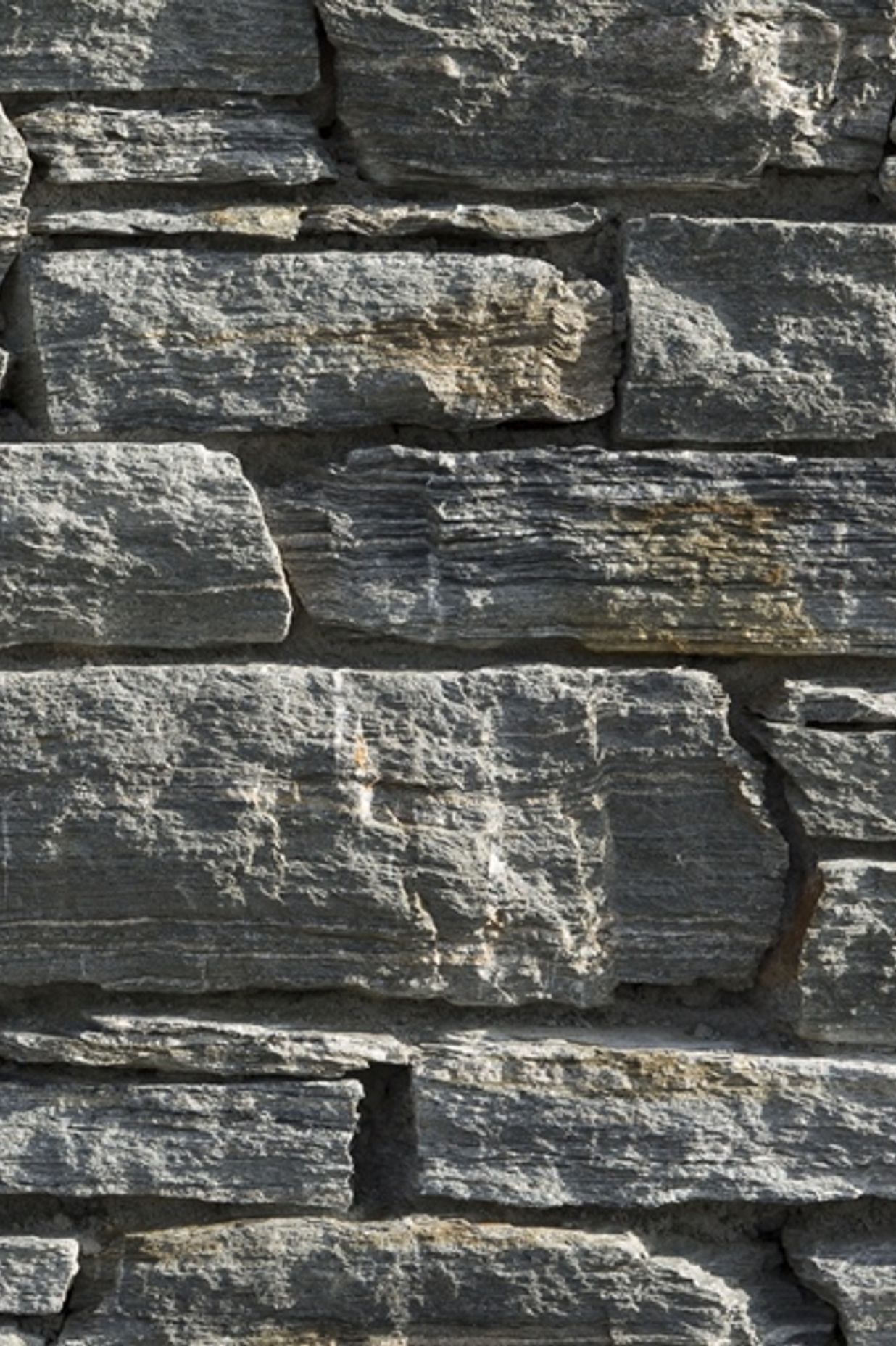 Poolburn Grey: Poolburn has a wide range of grey tones, the lighter grey tones have occasional streaks of brown while the steely blue-grey stone is a rich mid grey tone. The blue-grey stone has an attractive mica sheen and can occasionally green minerals