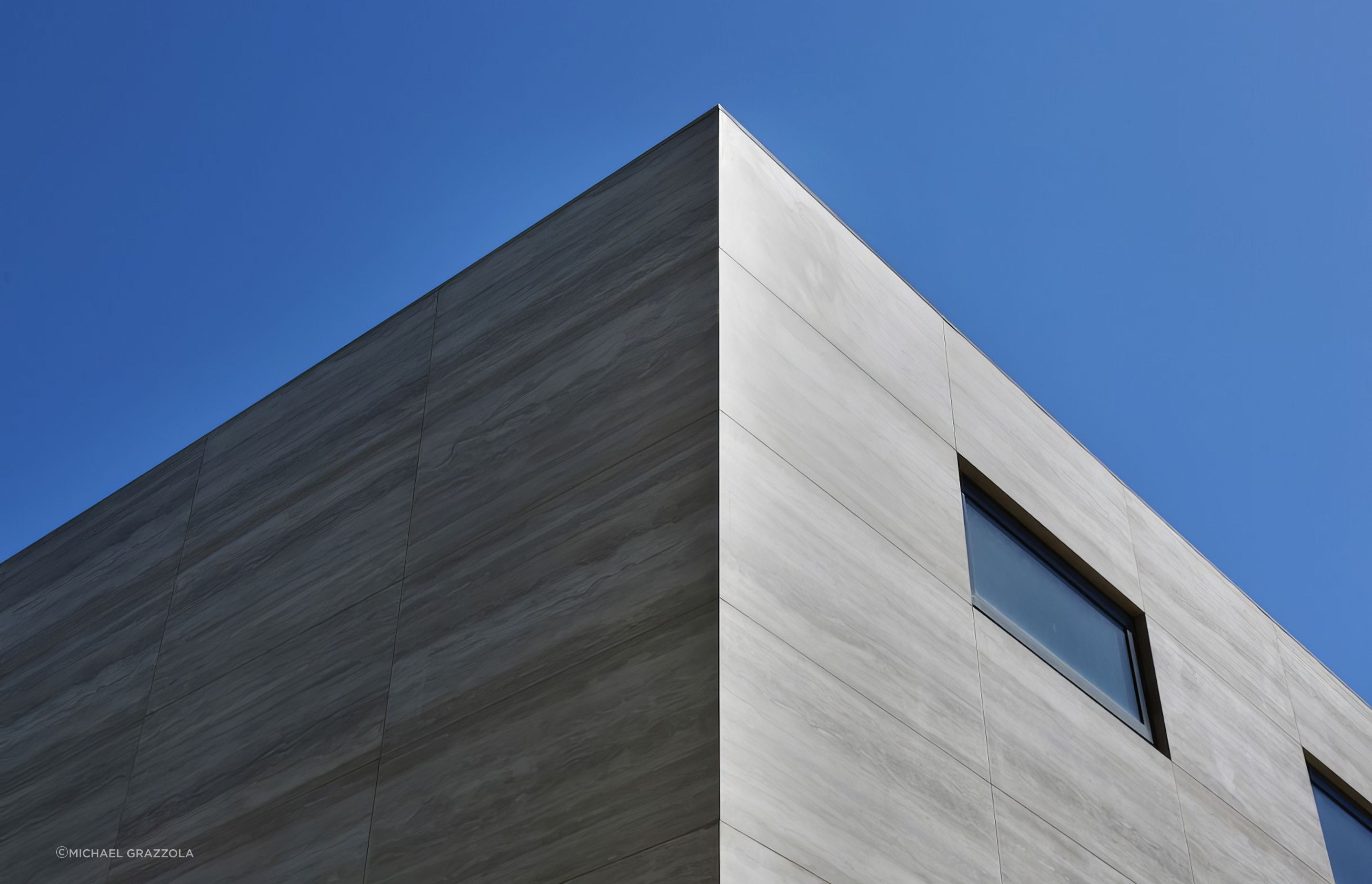 Maximum Travertino porcelain panels. Built by MJB. Designed by Tim Roberts Design.