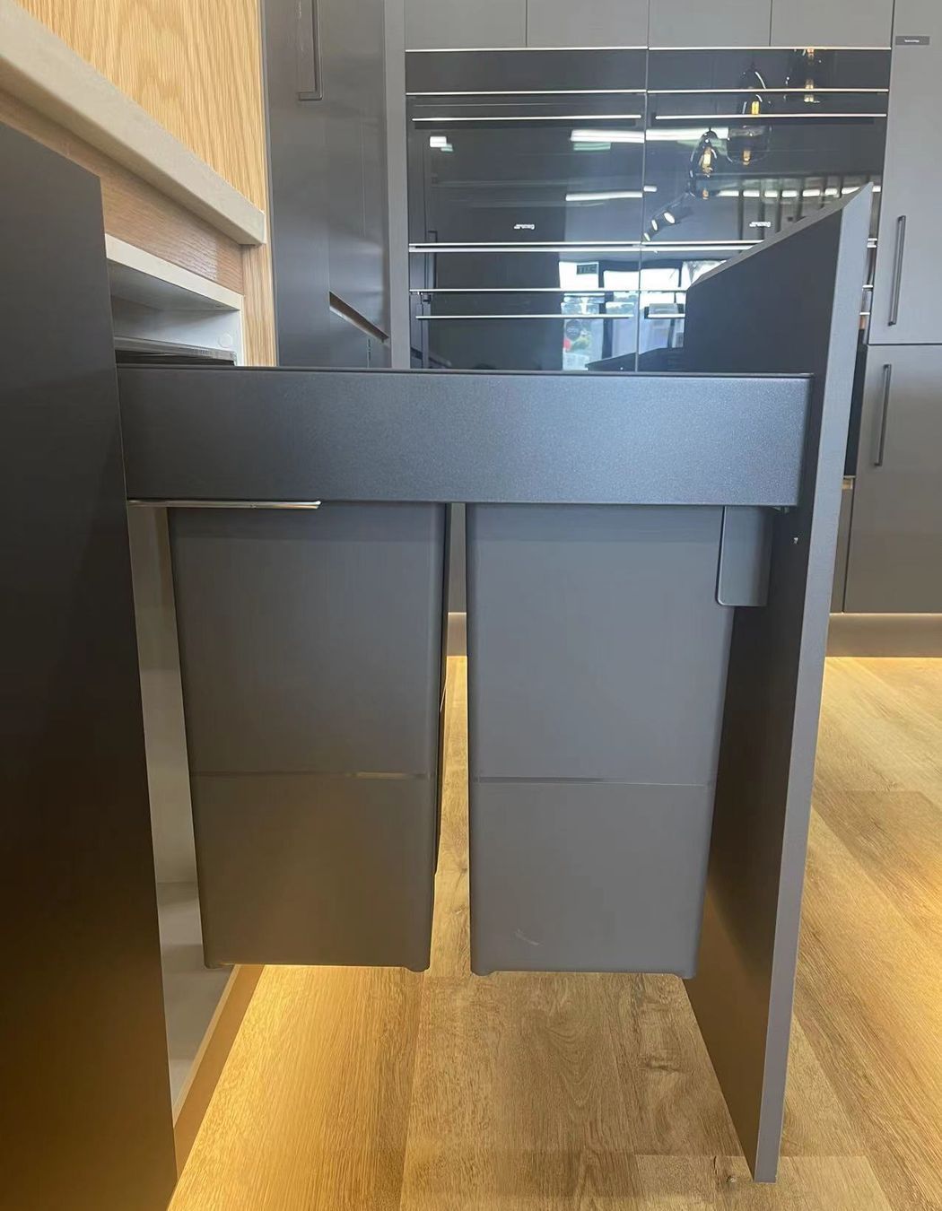 2 Full sized bins that can be pulled out from the cabinets in our Kitchen showroom in Auckland
