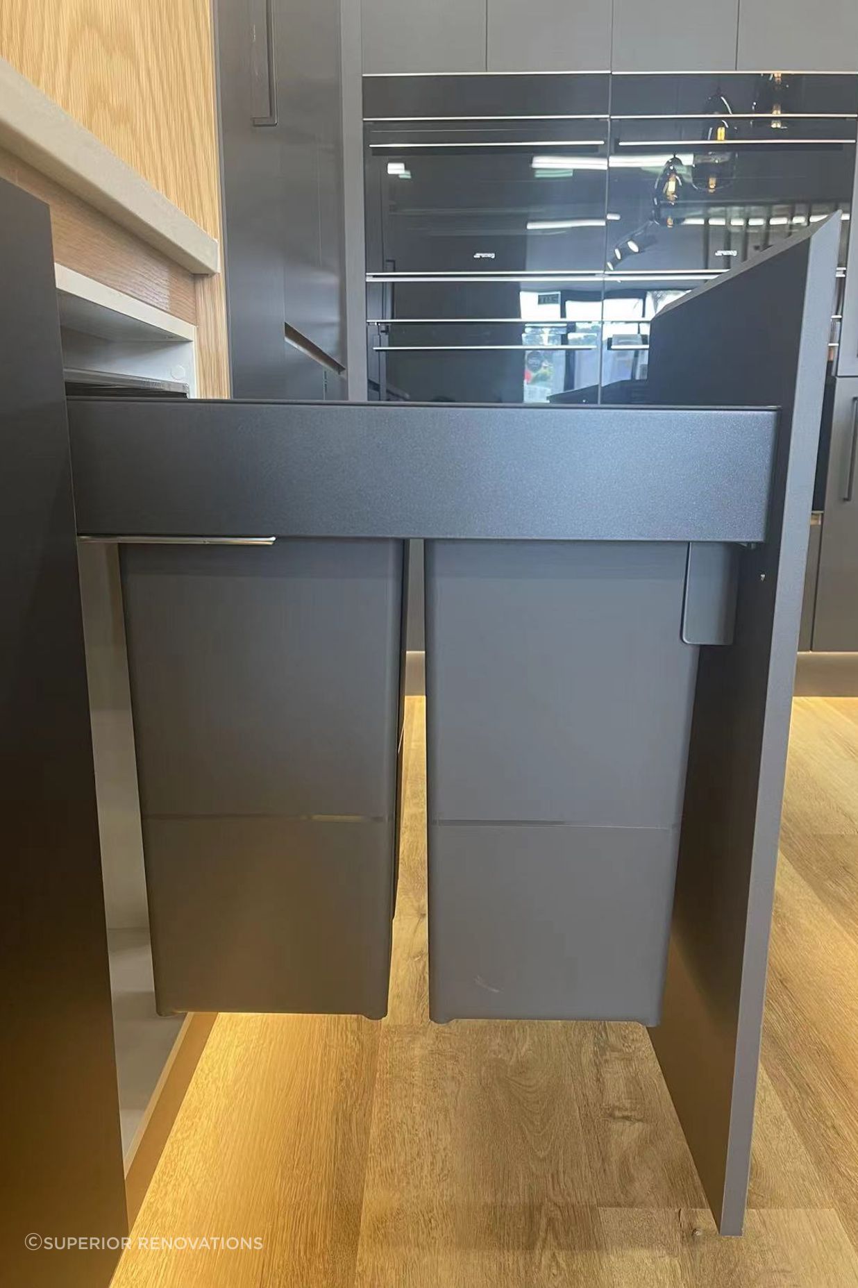 2 Full sized bins that can be pulled out from the cabinets in our Kitchen showroom in Auckland