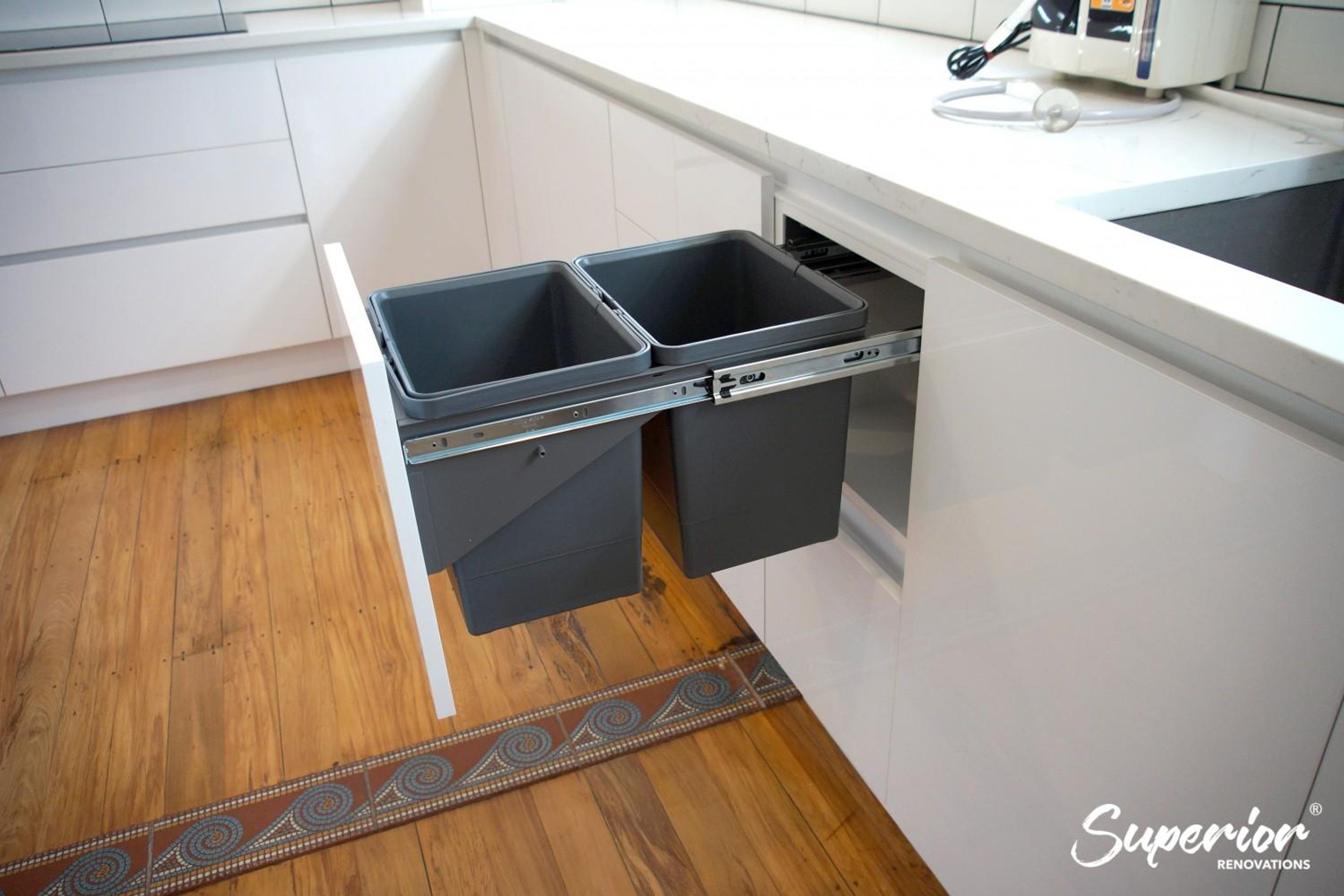 Pull out waste basket near sink