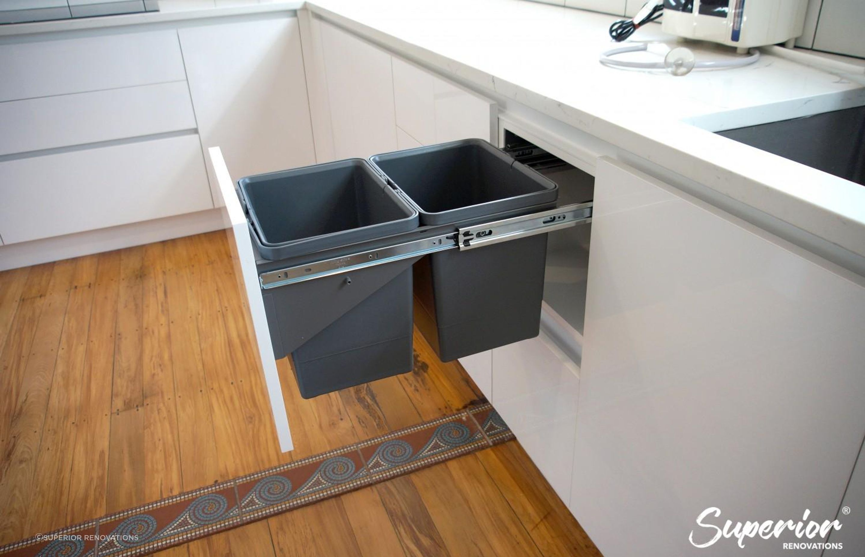 Pull out waste basket near sink
