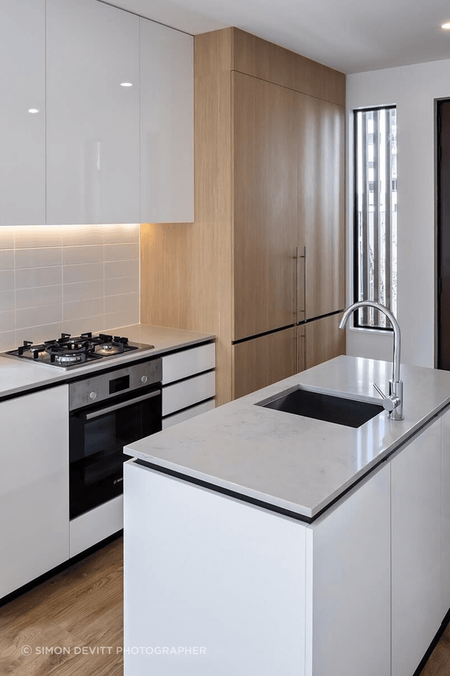 Apartment kitchen and island with PureCoat™ cabinetry