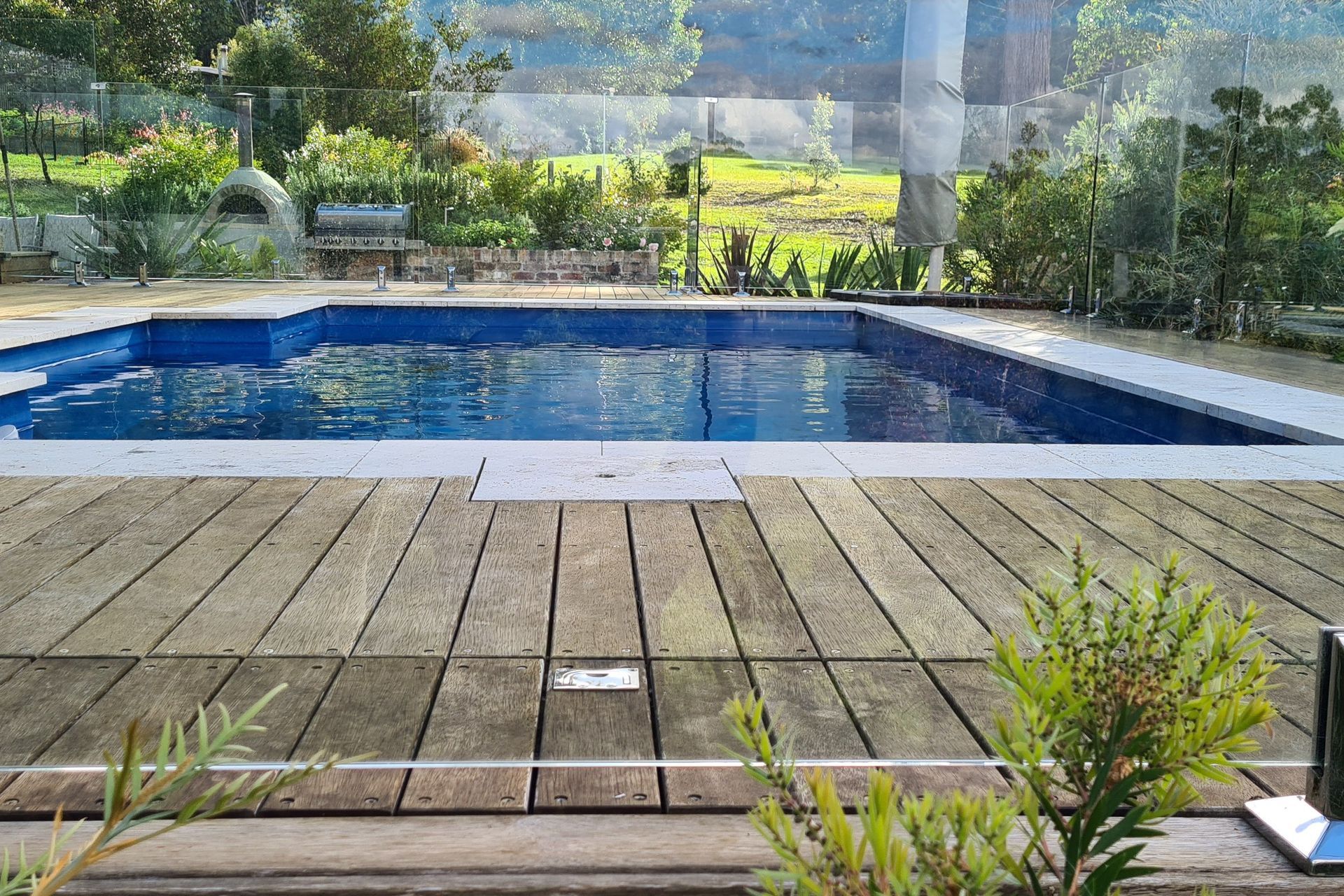 DECKING DELIGHT AT FALLS CREEK | Pool cover system concealed in Merbau decking