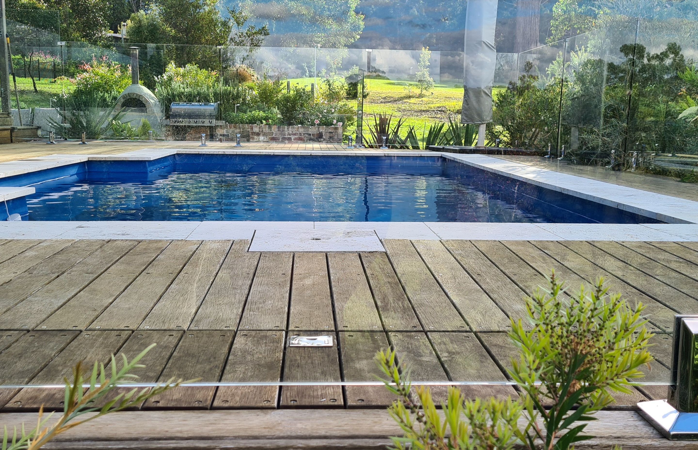 DECKING DELIGHT AT FALLS CREEK | Pool cover system concealed in Merbau decking