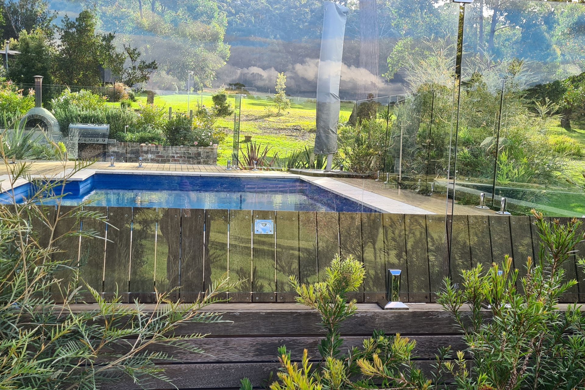 DECKING DELIGHT AT FALLS CREEK | Pool cover system concealed in Merbau decking