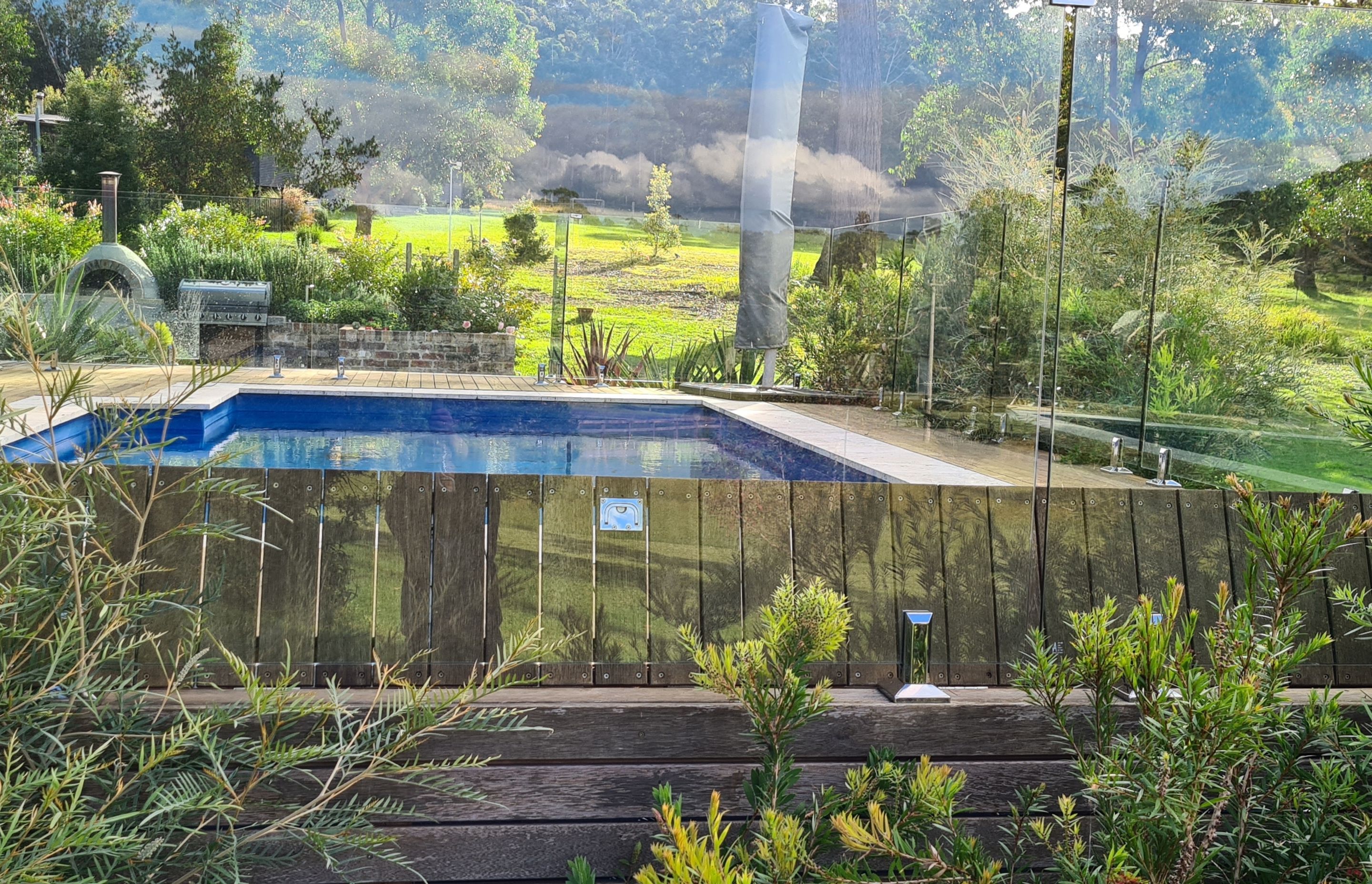 DECKING DELIGHT AT FALLS CREEK | Pool cover system concealed in Merbau decking