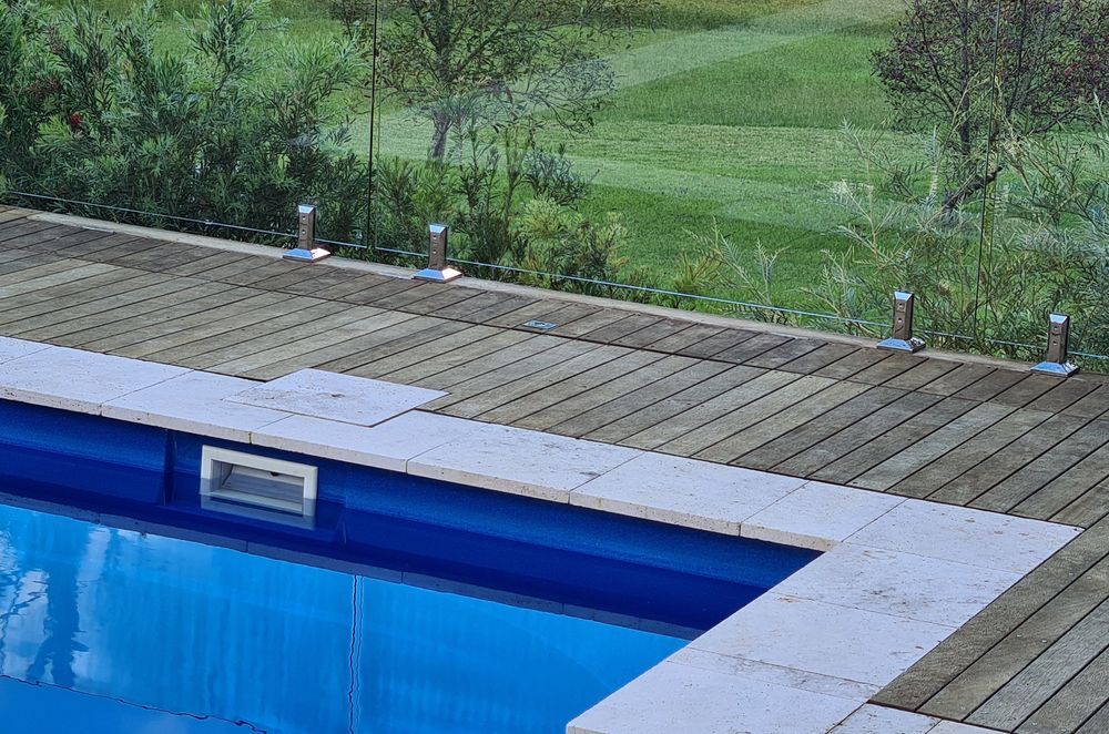 DECKING DELIGHT AT FALLS CREEK | Pool cover system concealed in Merbau decking