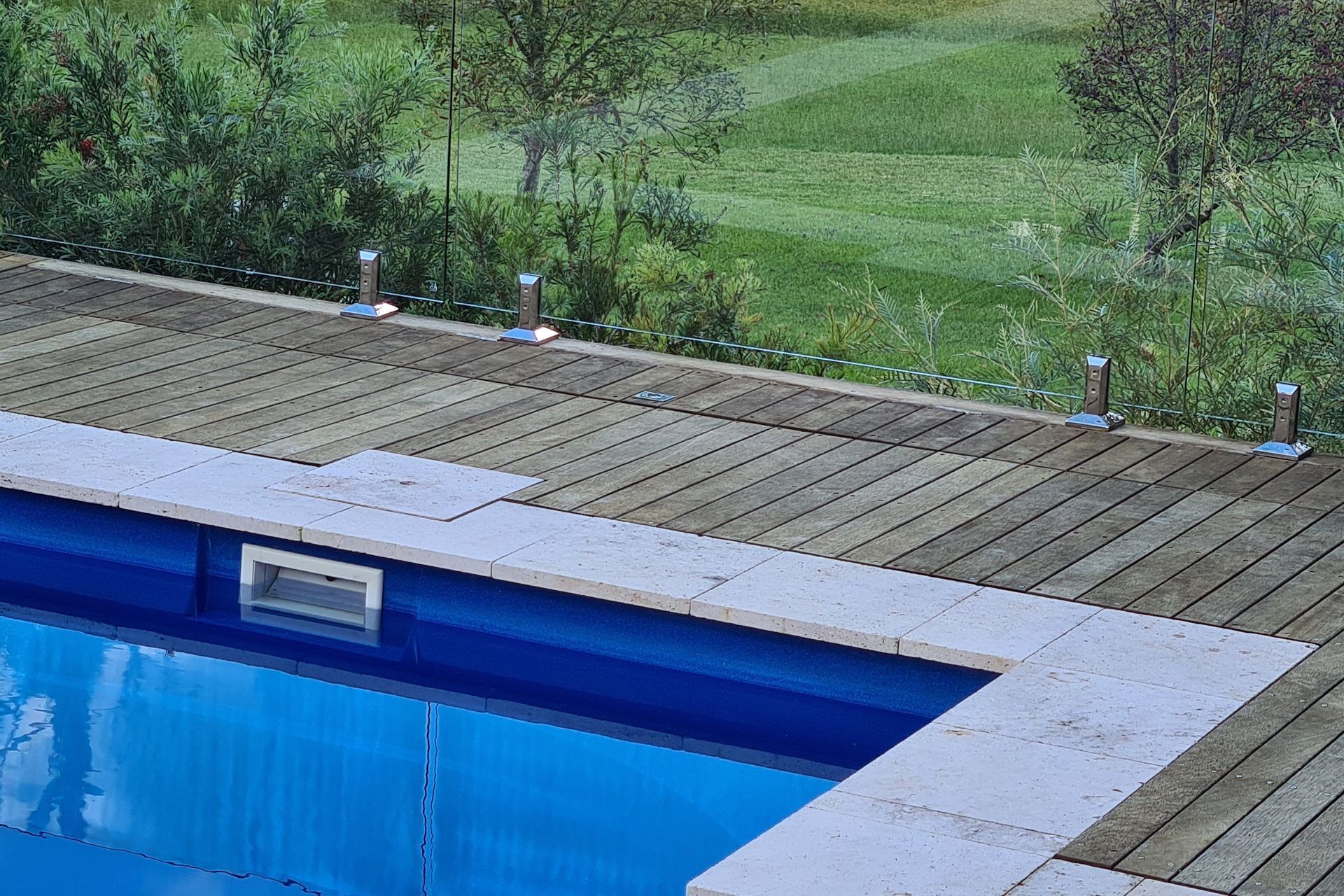 DECKING DELIGHT AT FALLS CREEK | Pool cover system concealed in Merbau decking