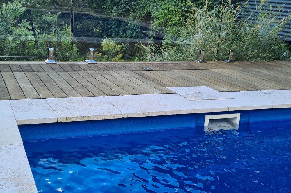 DECKING DELIGHT AT FALLS CREEK | Pool cover system concealed in Merbau decking