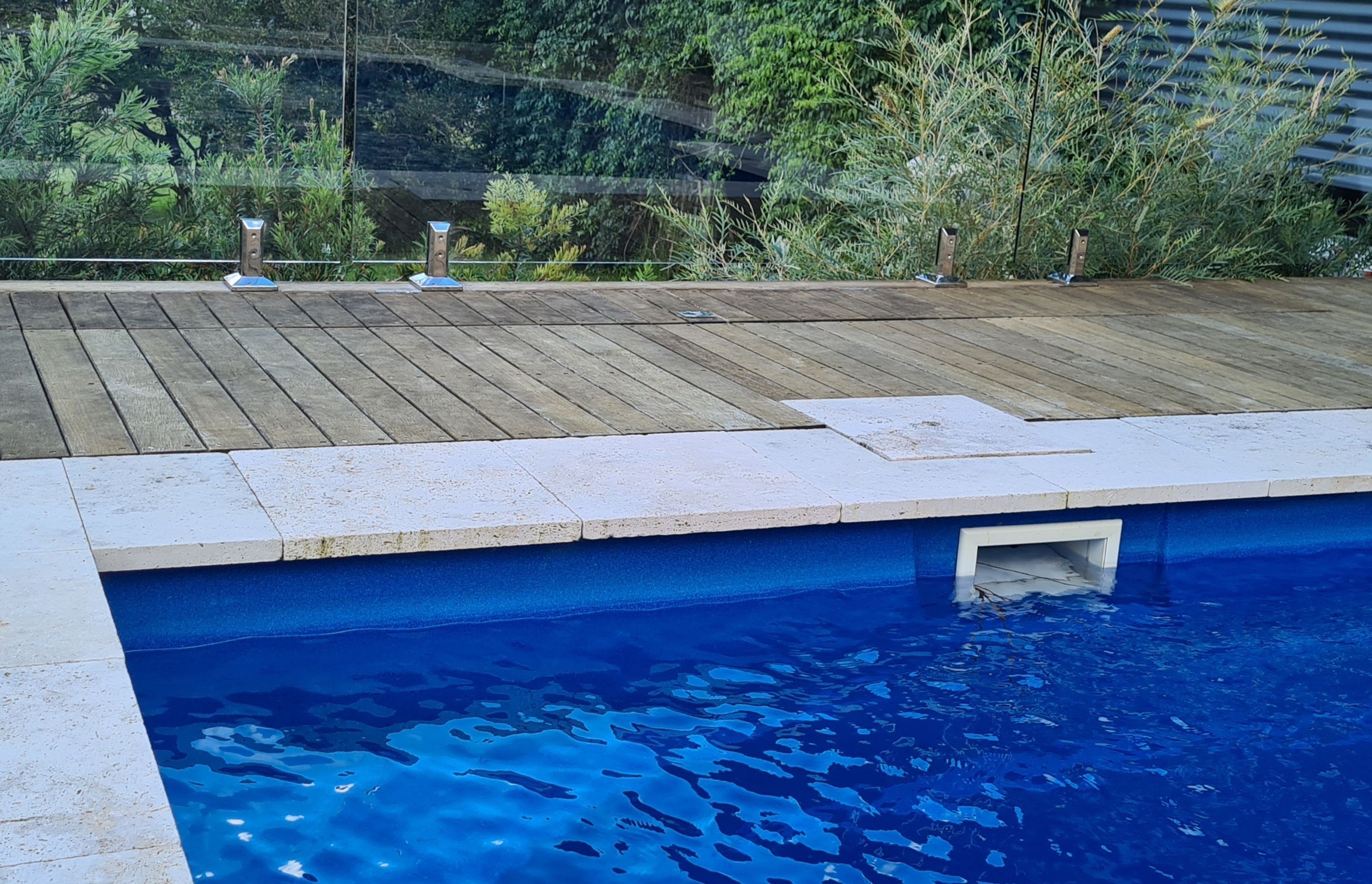 DECKING DELIGHT AT FALLS CREEK | Pool cover system concealed in Merbau decking