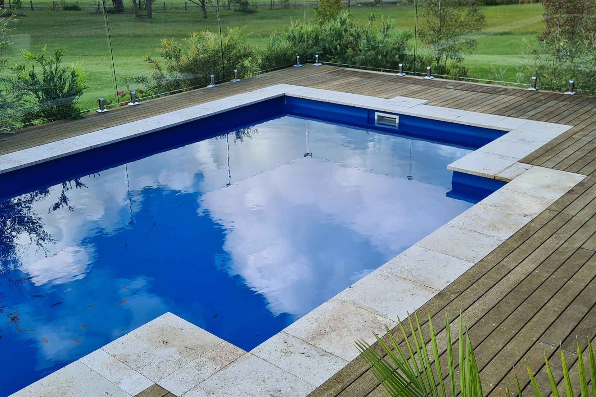 DECKING DELIGHT AT FALLS CREEK | Pool cover system concealed in Merbau decking