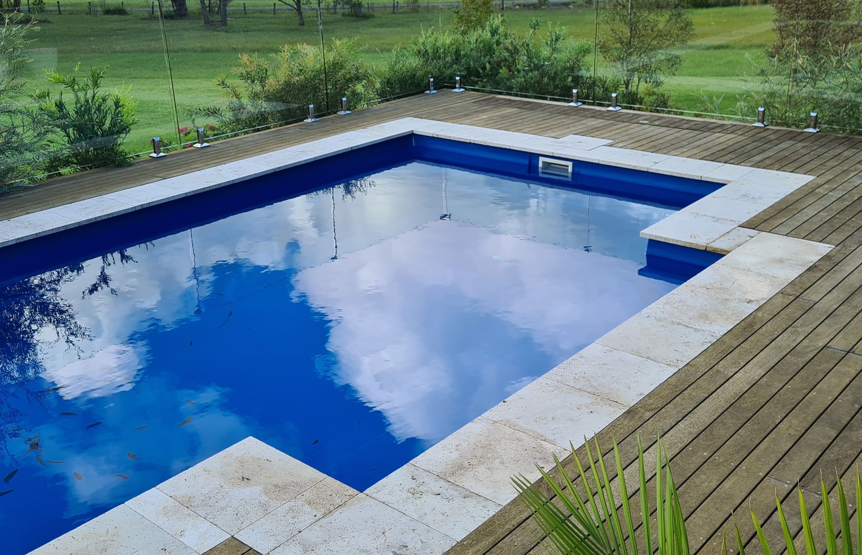 DECKING DELIGHT AT FALLS CREEK | Pool cover system concealed in Merbau decking