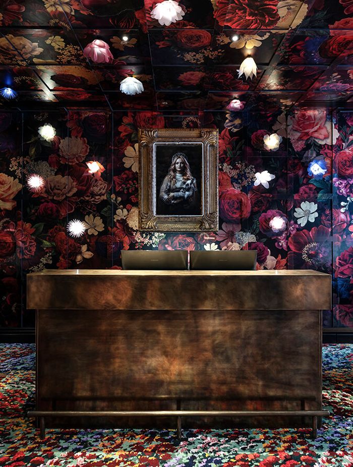 Material Creative weaves a tale from the moment guests step into reception, with rugs based on artwork by Karl Maughan by Designer Rugs. The floral and gold leaf wall mural was created by Haley Brown of The Art Dept and the photograph is by Ross Brown.