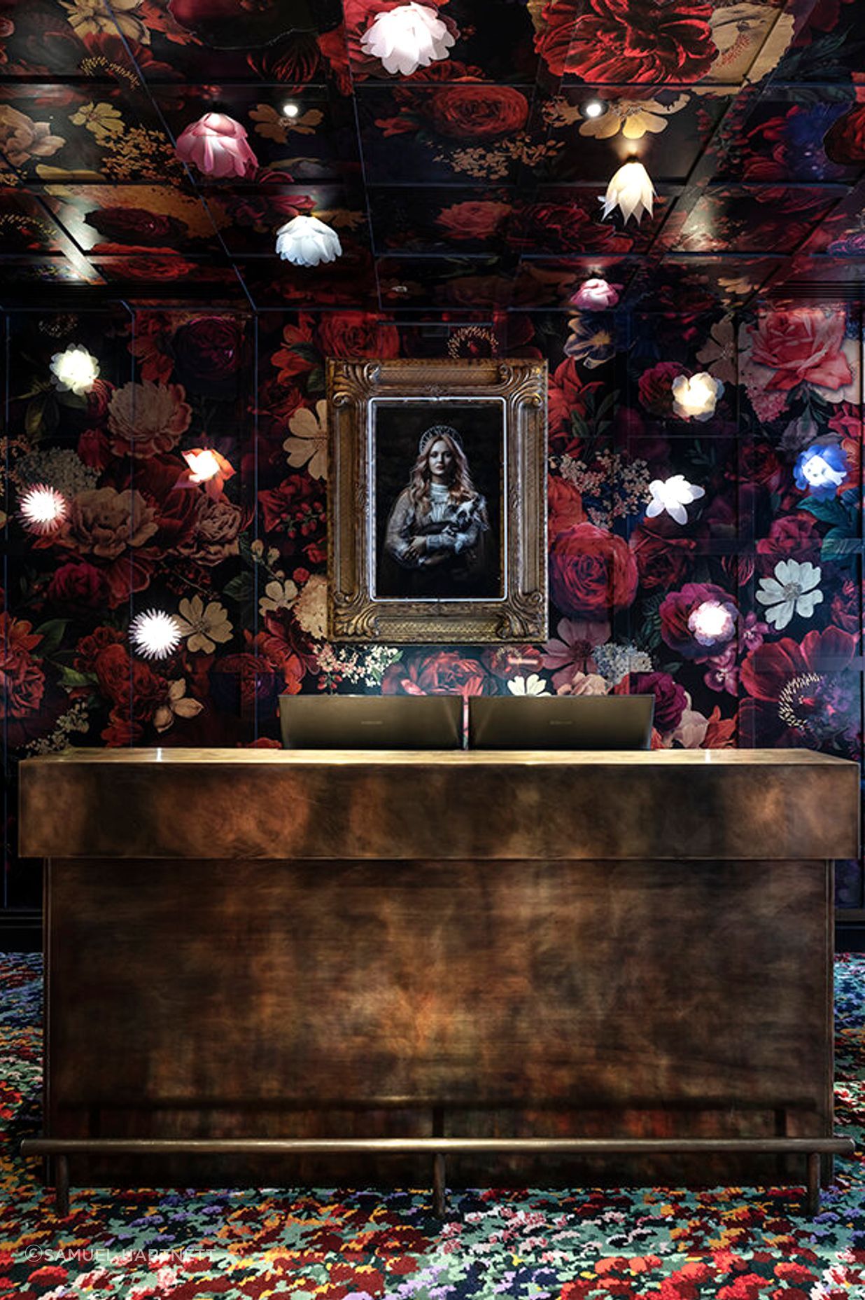 Material Creative weaves a tale from the moment guests step into reception, with rugs based on artwork by Karl Maughan by Designer Rugs. The floral and gold leaf wall mural was created by Haley Brown of The Art Dept and the photograph is by Ross Brown.