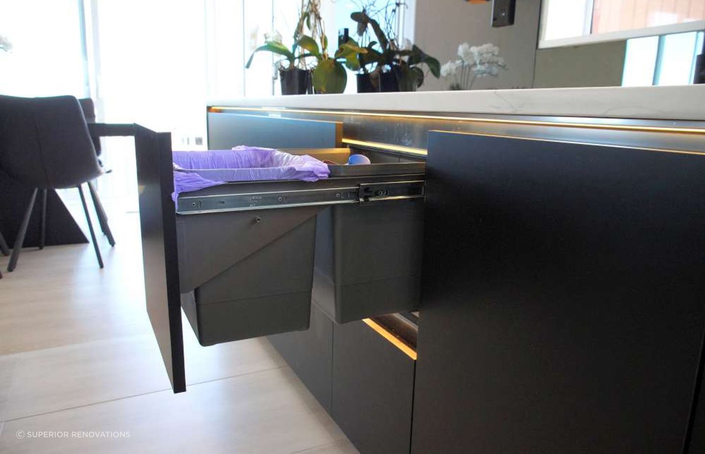 Pull out rubbish and recycling bins.