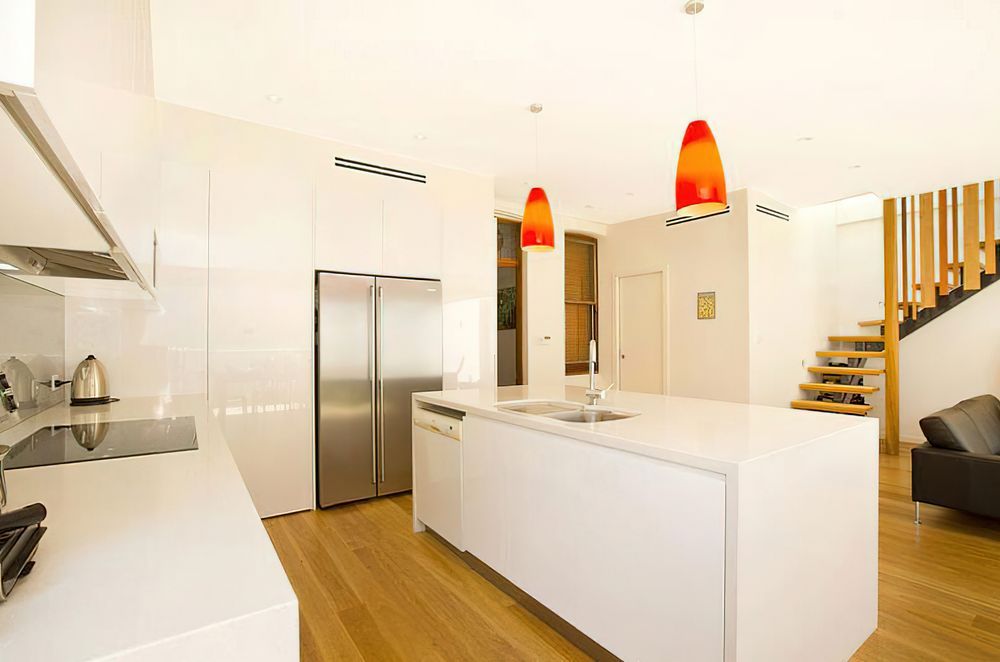 Wood composite hybrid flooring is a popular option for environments where splashes and spills occur, such as a kitchen.