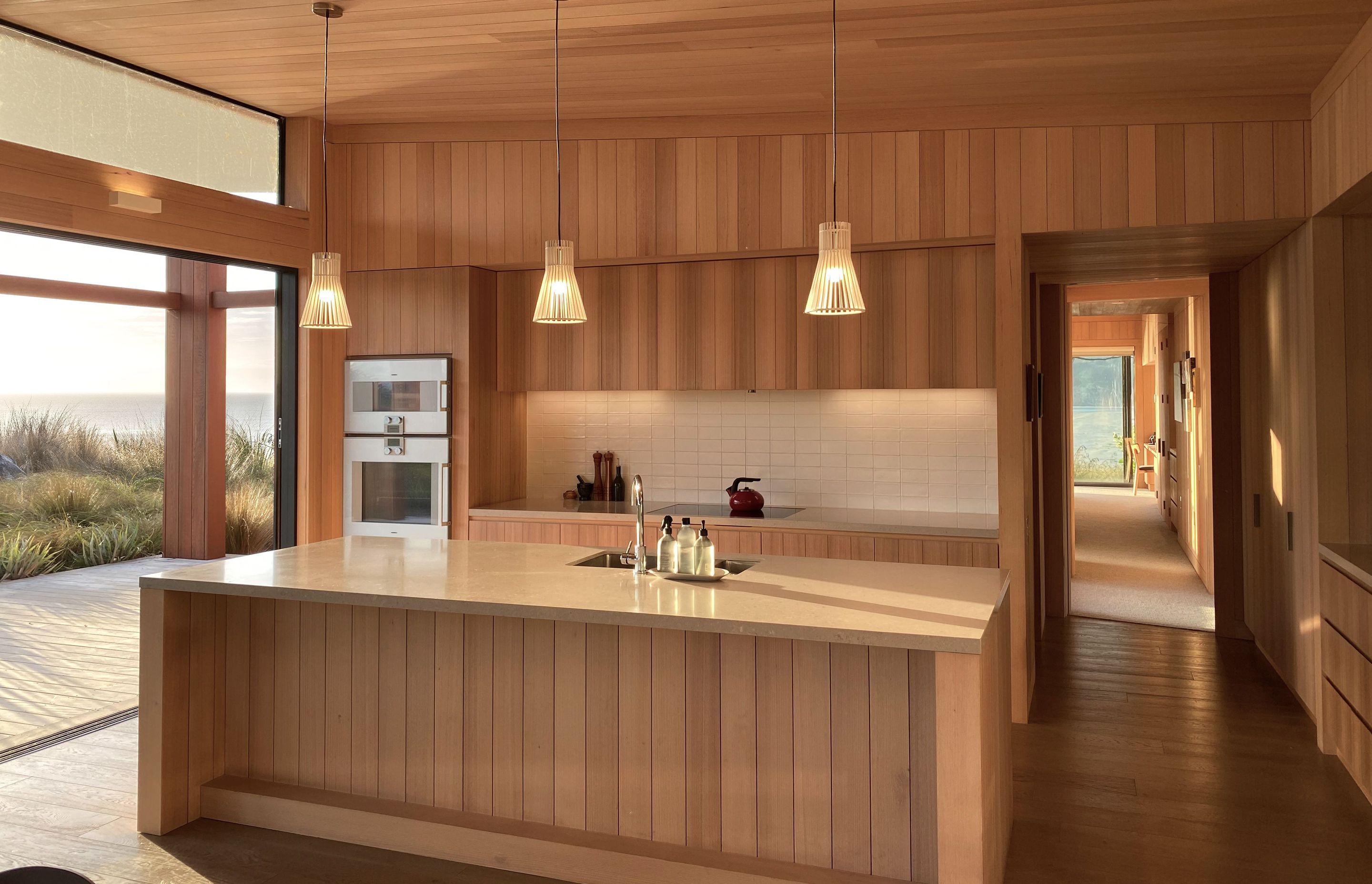 Coastal Retreat’s kitchen, clad in beautiful Tasmanian oak. | Photographer: Ruth Whitaker