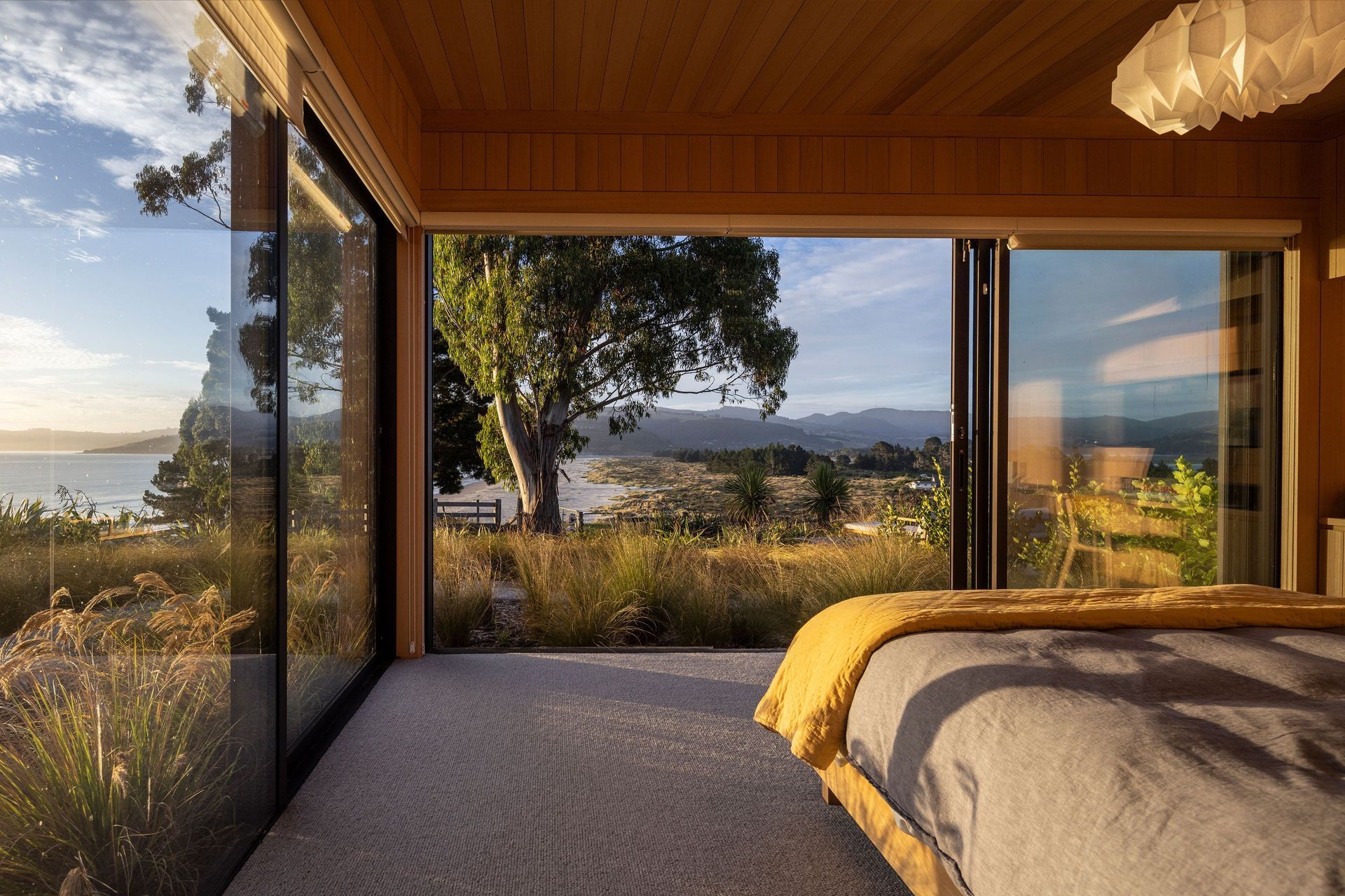 The master bedroom, overlooking Blueskin Bay. | Photographer: Graham Warman
