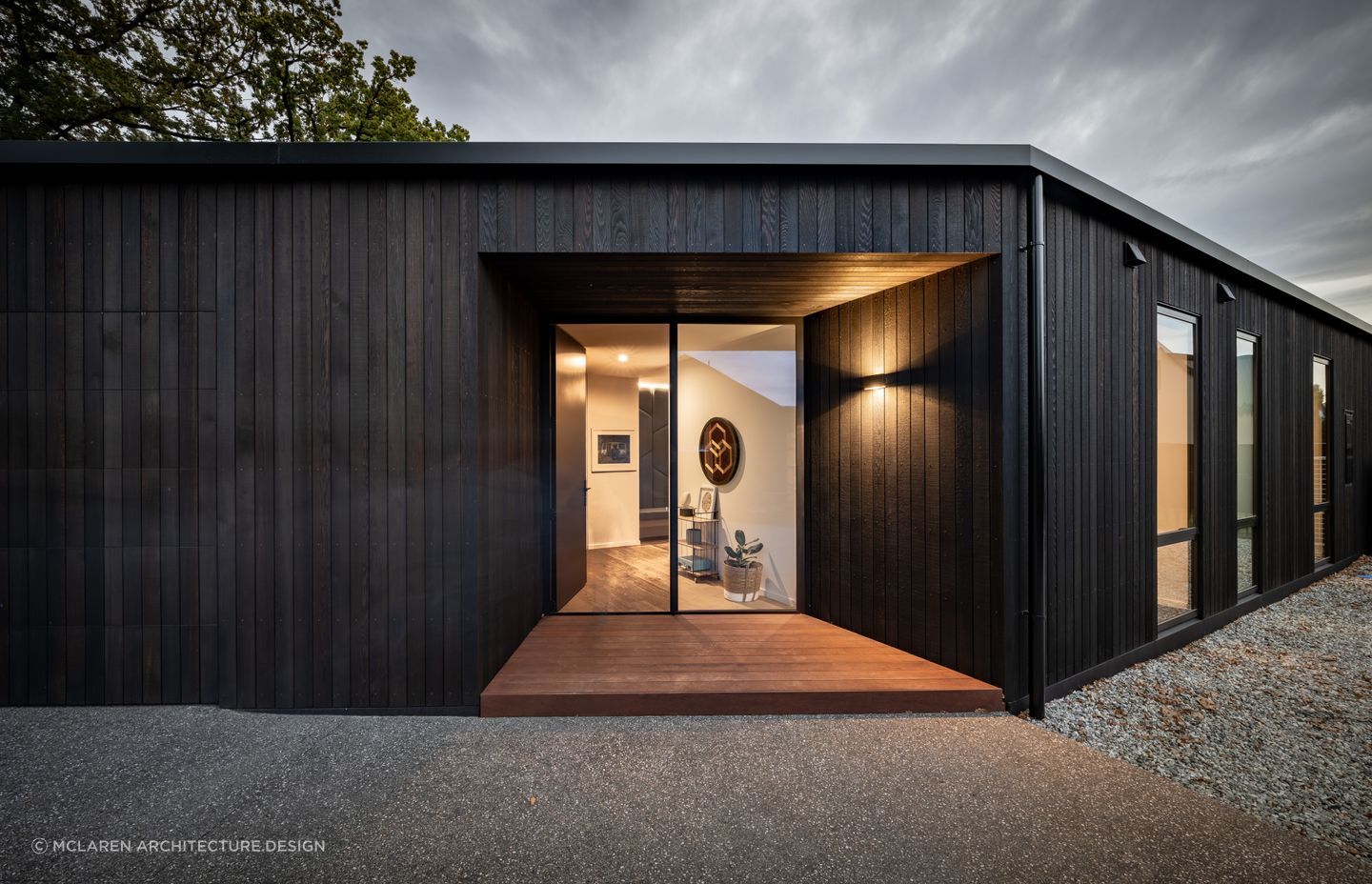 Creating a sense of perspective can be a great way to draw the eye when it comes to entryway design, expertly executed at this Oak Grove Residence - Photography: Larkin Photography
