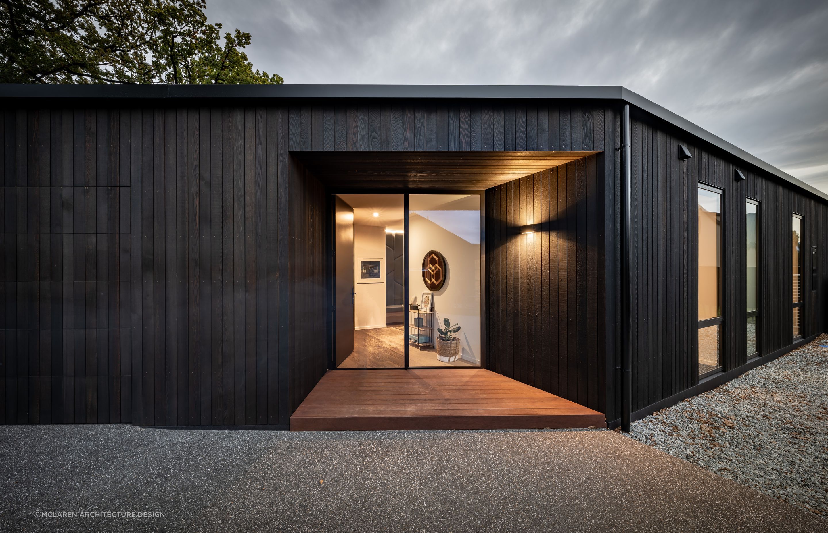 Creating a sense of perspective can be a great way to draw the eye when it comes to entryway design, expertly executed at this Oak Grove Residence - Photography: Larkin Photography