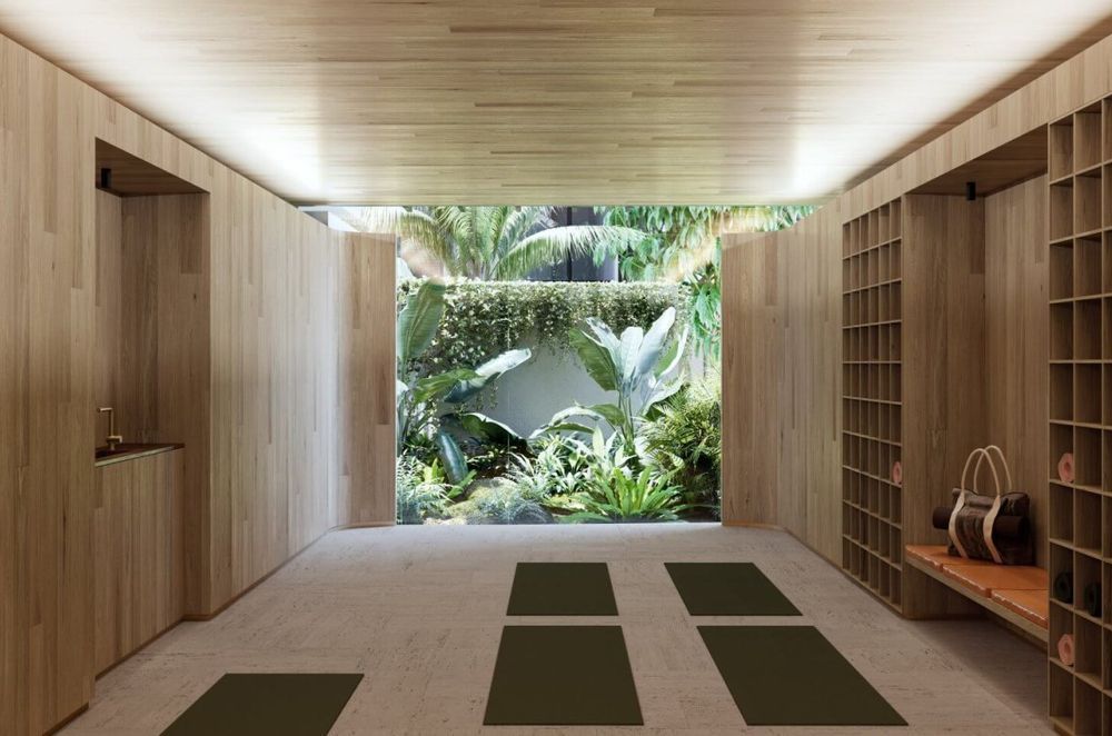 Lush tropical gardens are combined with running water and reflective surfaces throughout the lower level landscaping, while hydroponic green walls are dotted around the development.