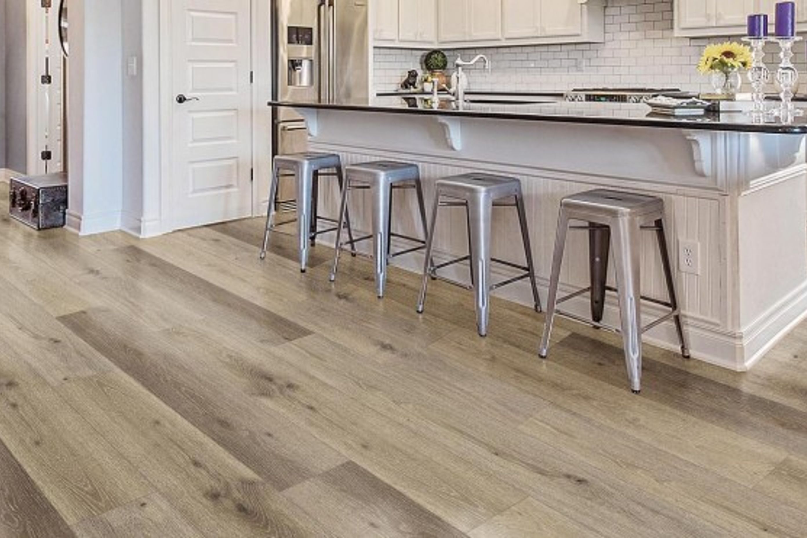 Neptune SPC used as Kitchen flooring for this open plan kitchen. This flooring is 100% water resistance, soft on your feet, durable, and warmer compared to tiles