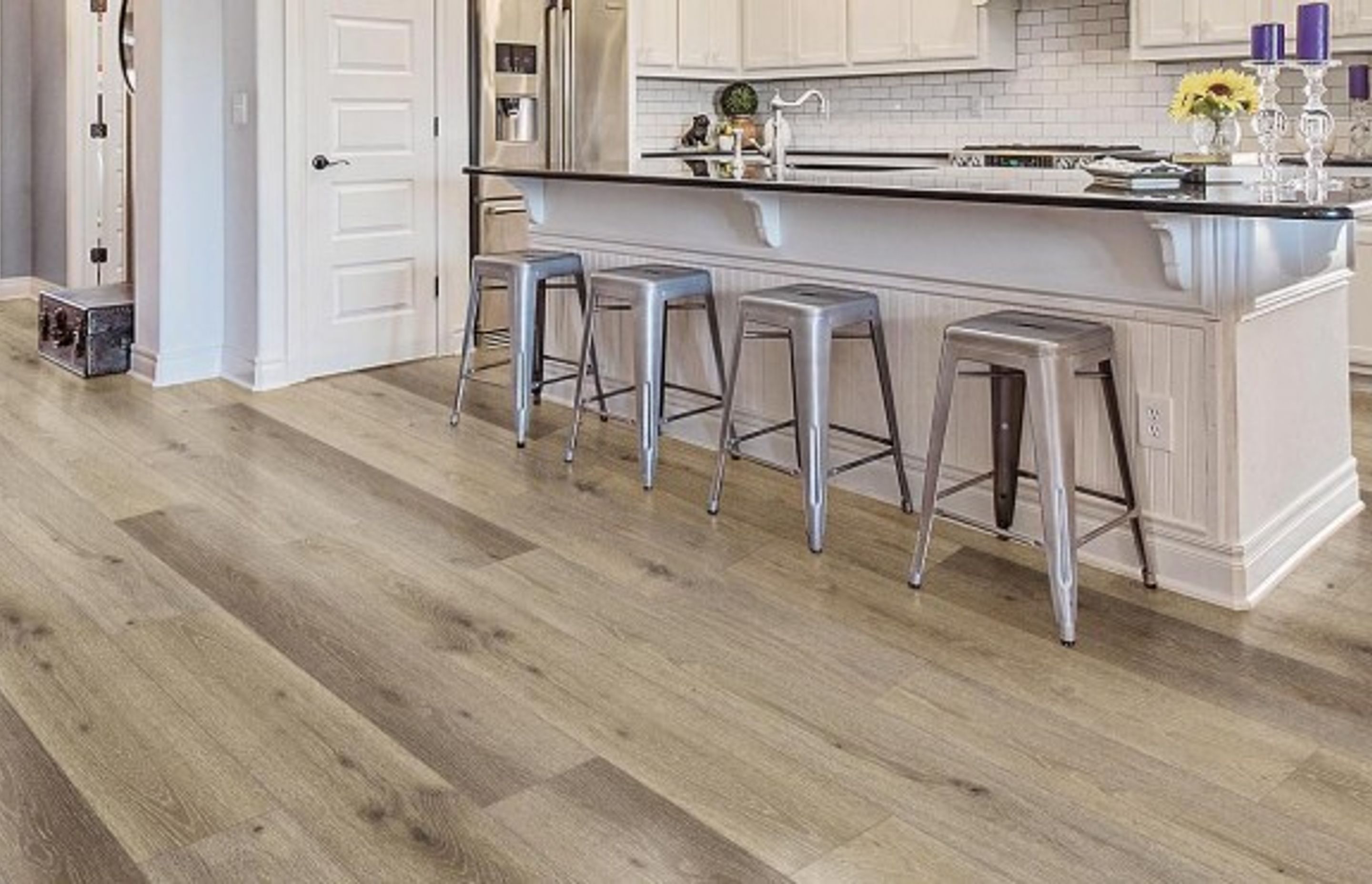 Neptune SPC used as Kitchen flooring for this open plan kitchen. This flooring is 100% water resistance, soft on your feet, durable, and warmer compared to tiles