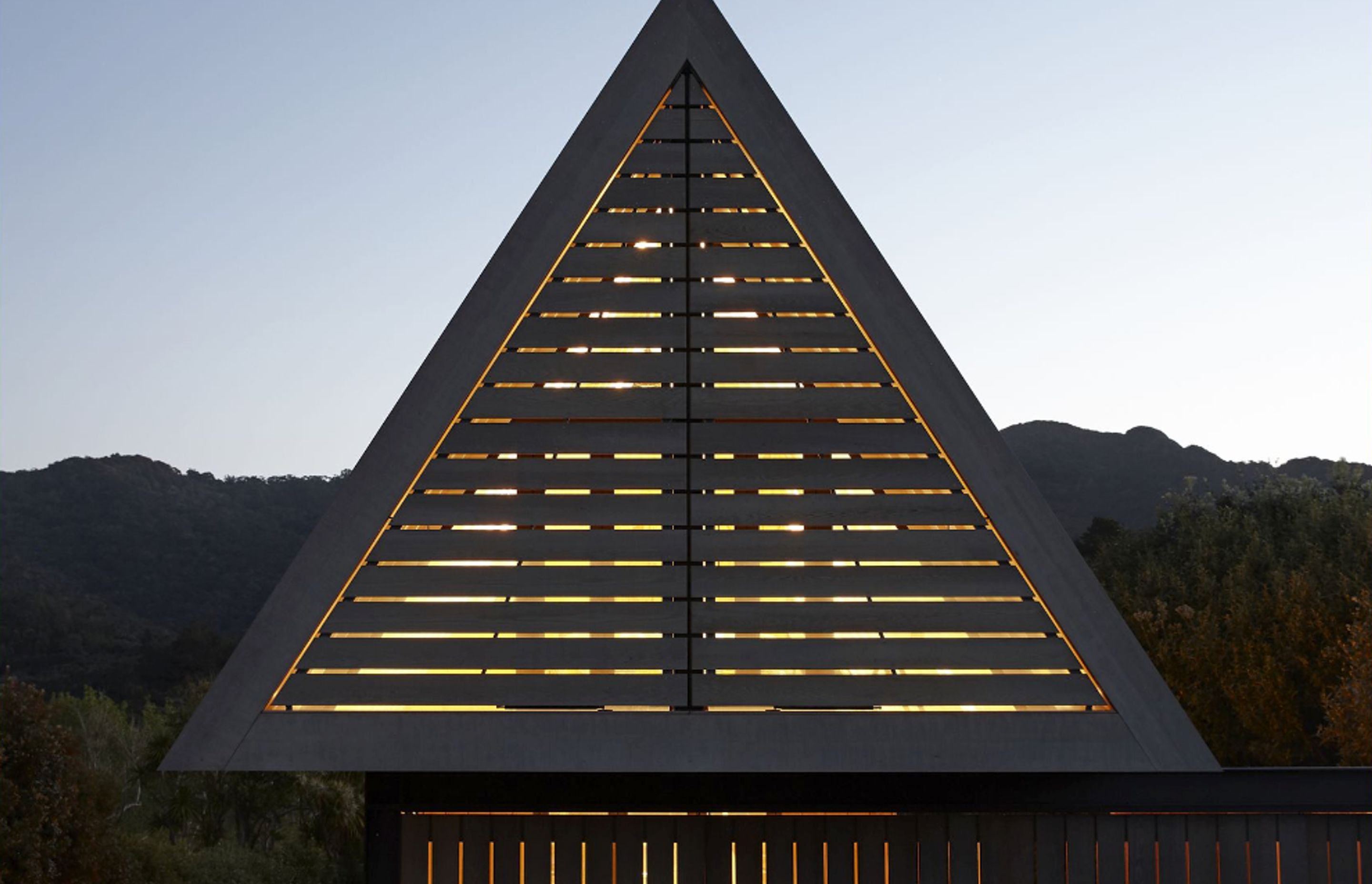 At night, when the dormer window shutters are closed, the triangle glows like a nautical beacon.