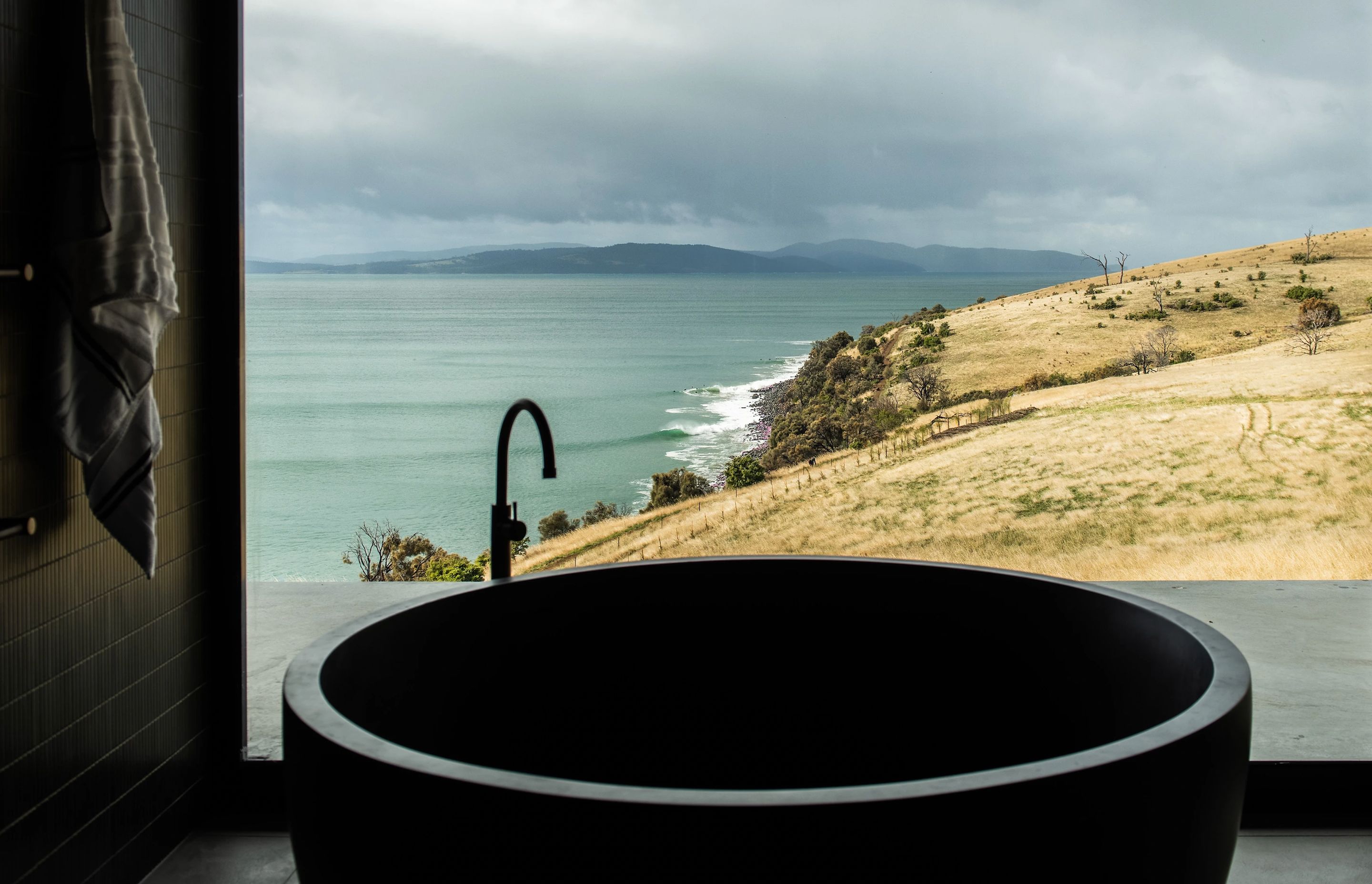 Positioned next to a large window, stone bathtubs can provide the ultimate in spa-like luxury.