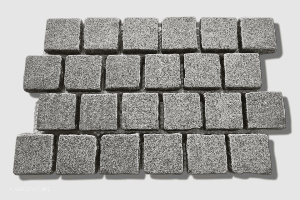 Silhouette Granite Tumbled Cobblestones launched in 2025. Dense mid-grey granite with P5 slip resistance, mounted on mesh sheets in brick bond pattern. The 90×90×30mm format is ideal for driveways, pathways, courtyards, and high-traffic outdoor areas.