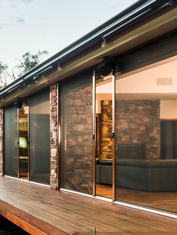 Caption: A Securo side roll blind operates just like a sliding door for ease of access. Here it is shown in Phiferglass insect screen fabric.