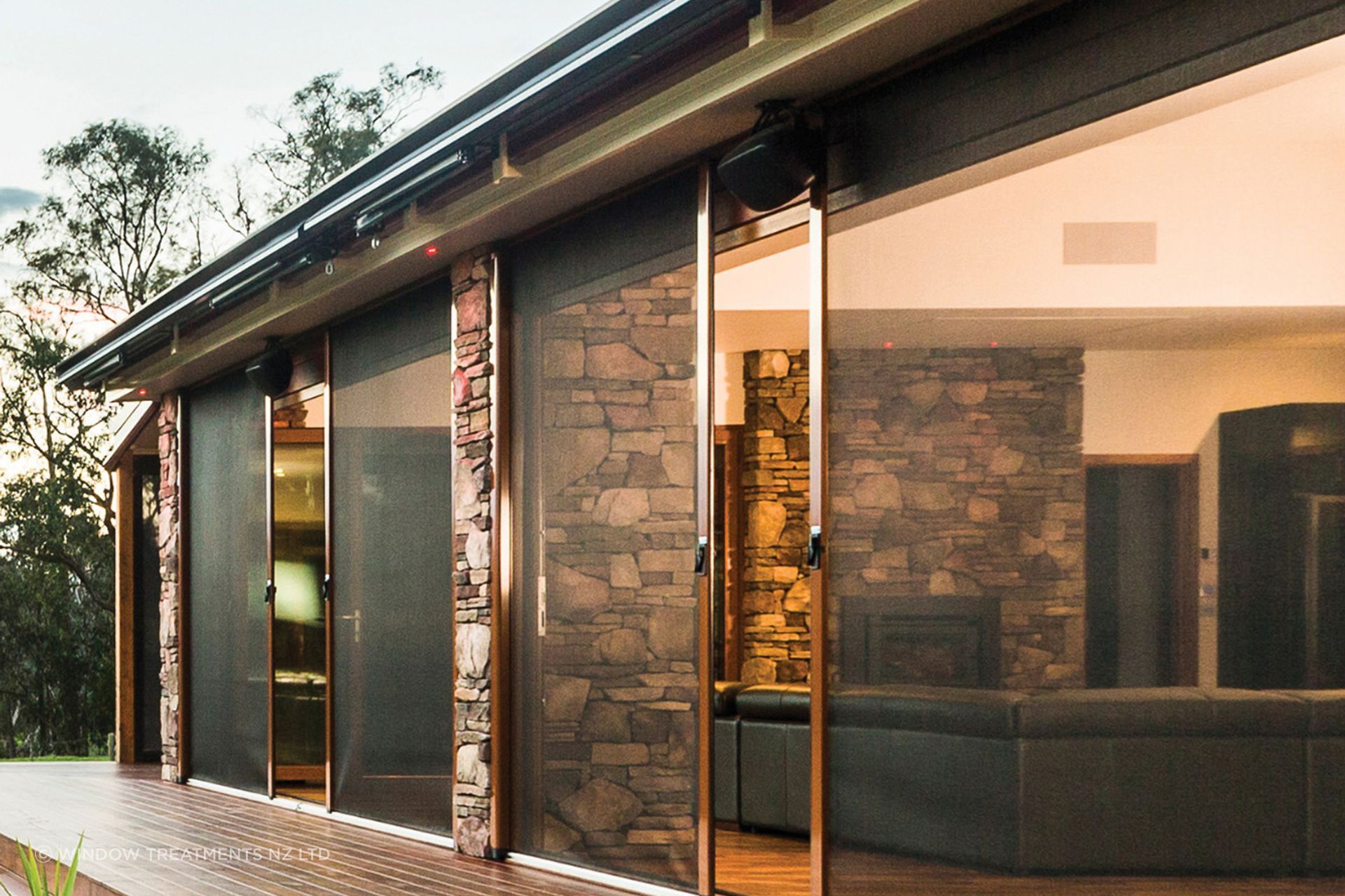 Caption: A Securo side roll blind operates just like a sliding door for ease of access. Here it is shown in Phiferglass insect screen fabric.