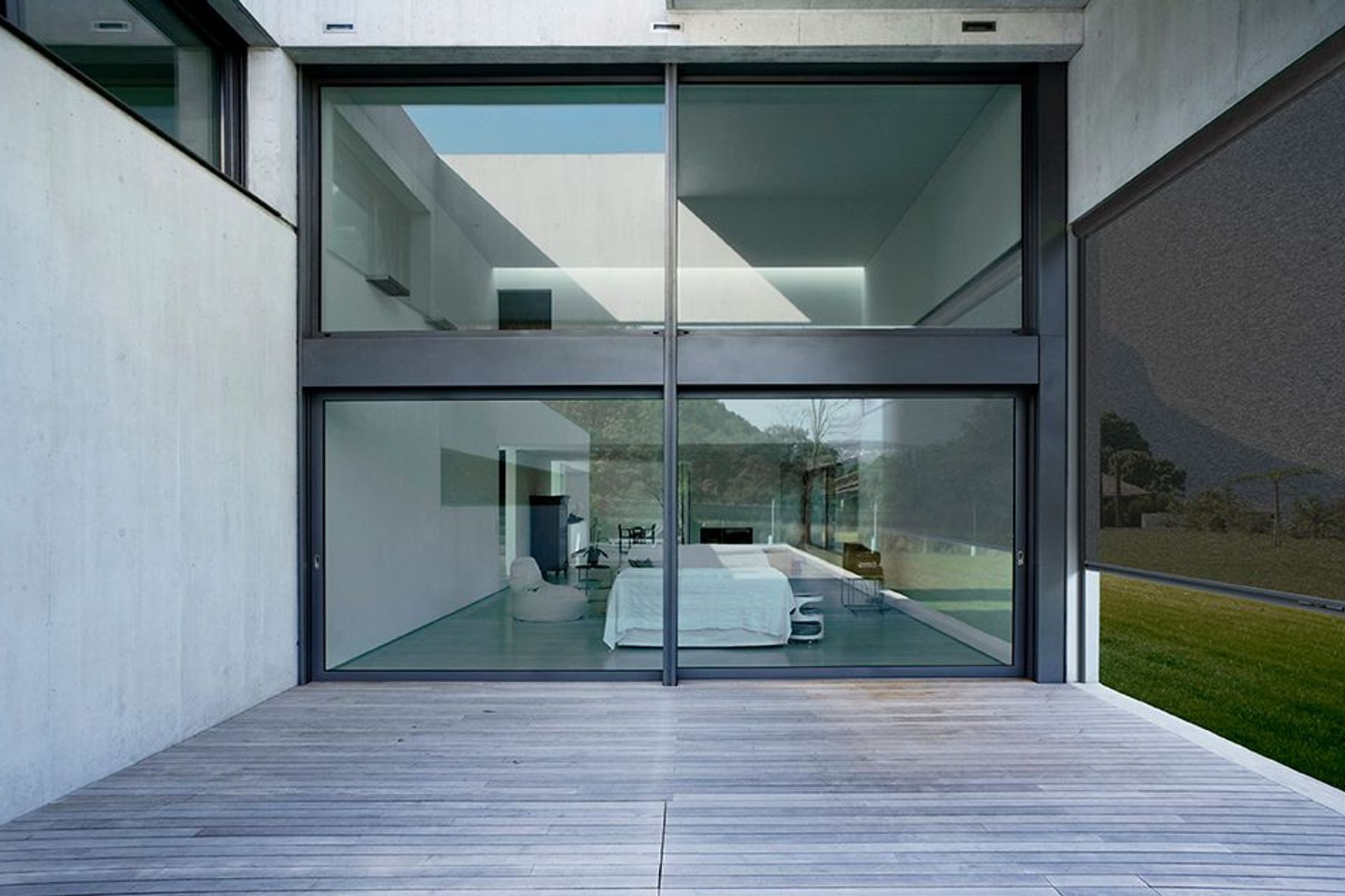 This Ziptrak screen maximises the outdoor area connected to the bedroom, creating an extra living area.