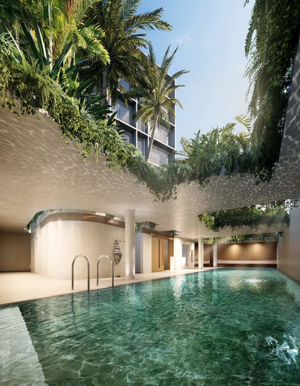 The pavilions above the semi-covered indoor/outdoor pool are planted with greenery that will drape down over the pool.