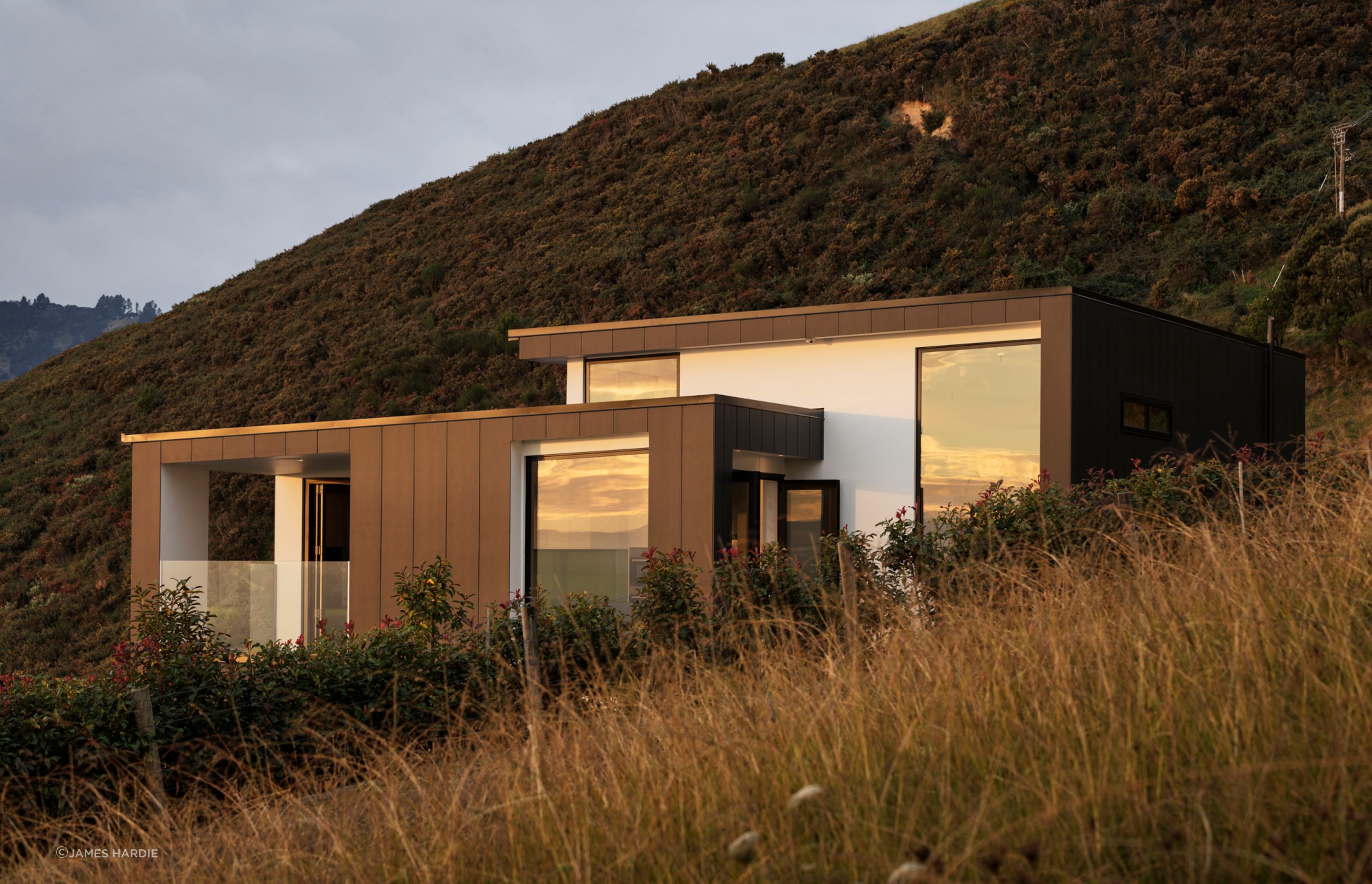 Fibre cement panels provide a sleek look with bold colours and strong lines.