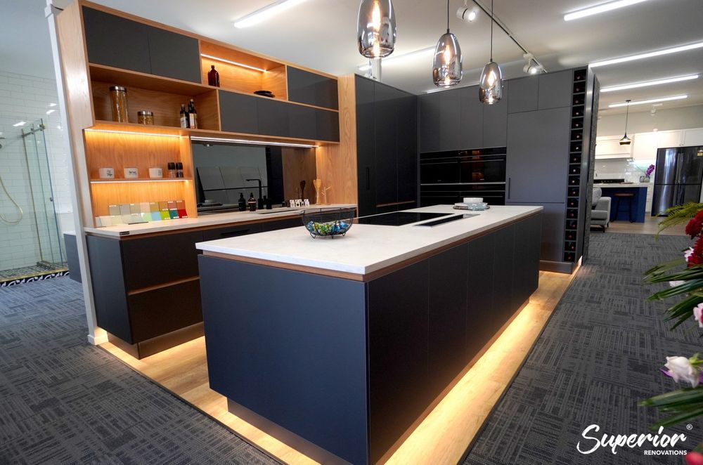 Our renovation showroom in Wairau Valley, Auckland. This is a great example of a modern and sleek kitchen which has storage on both sides of the kitchen island.
