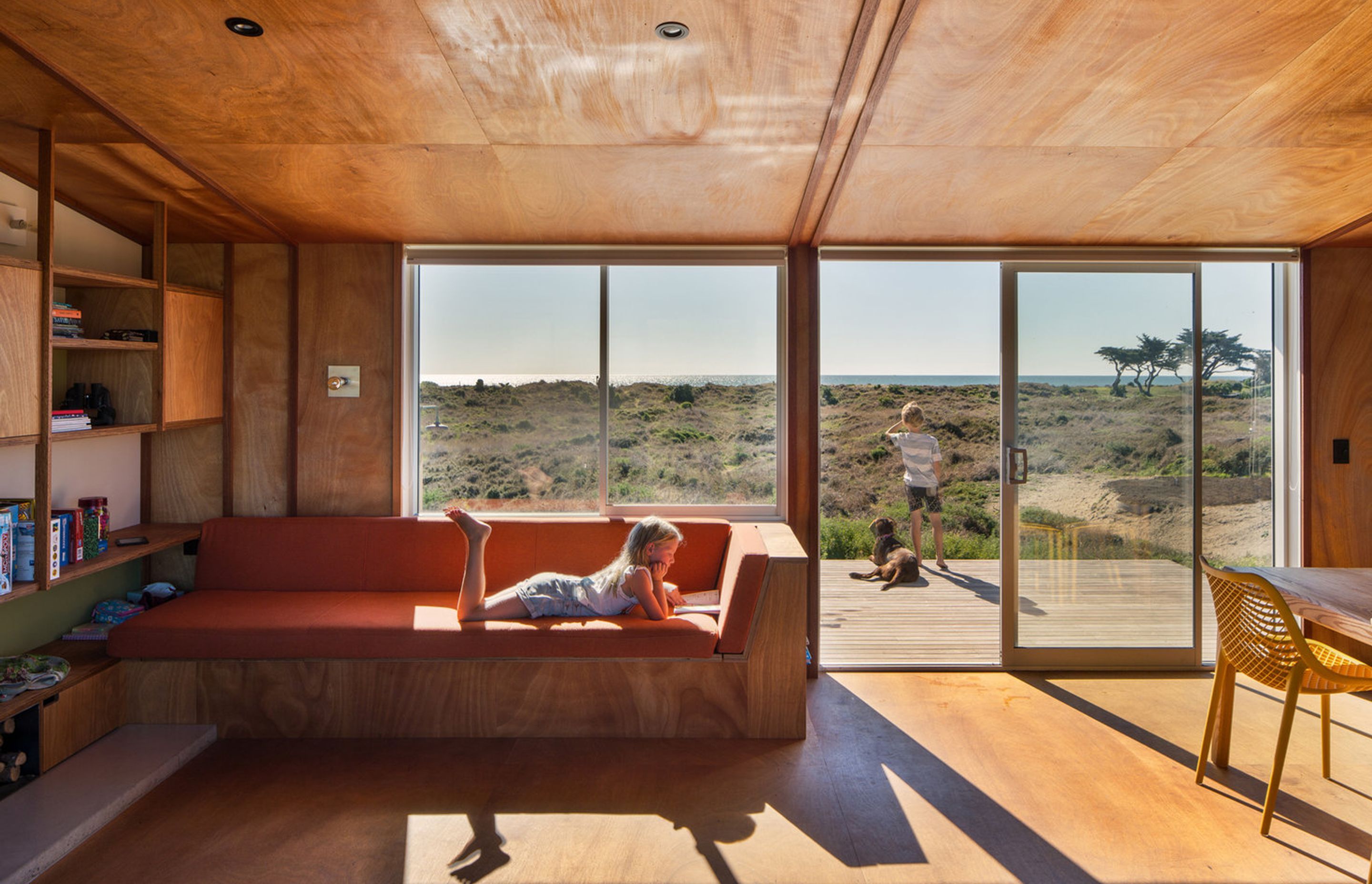 Parsonson Architects' design of Te Horo Beach House responds to the surrounding sand dunes with bach-style living, materials and colours that respond to the local environment. Photograph by Paul McCredie.